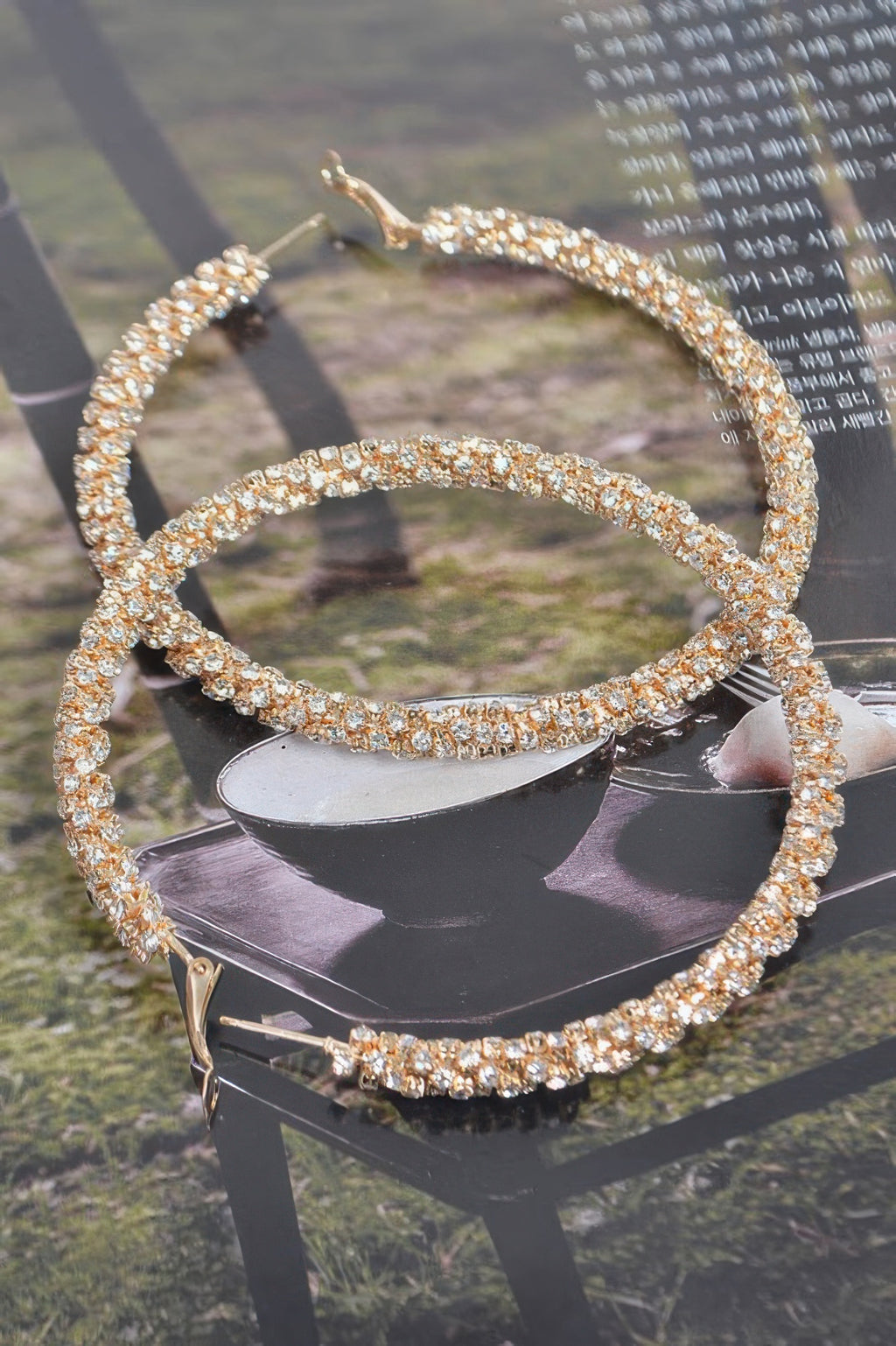 Gold-tone twisted rhinestone hoop earrings, large round hoops with rhinestone sparkle