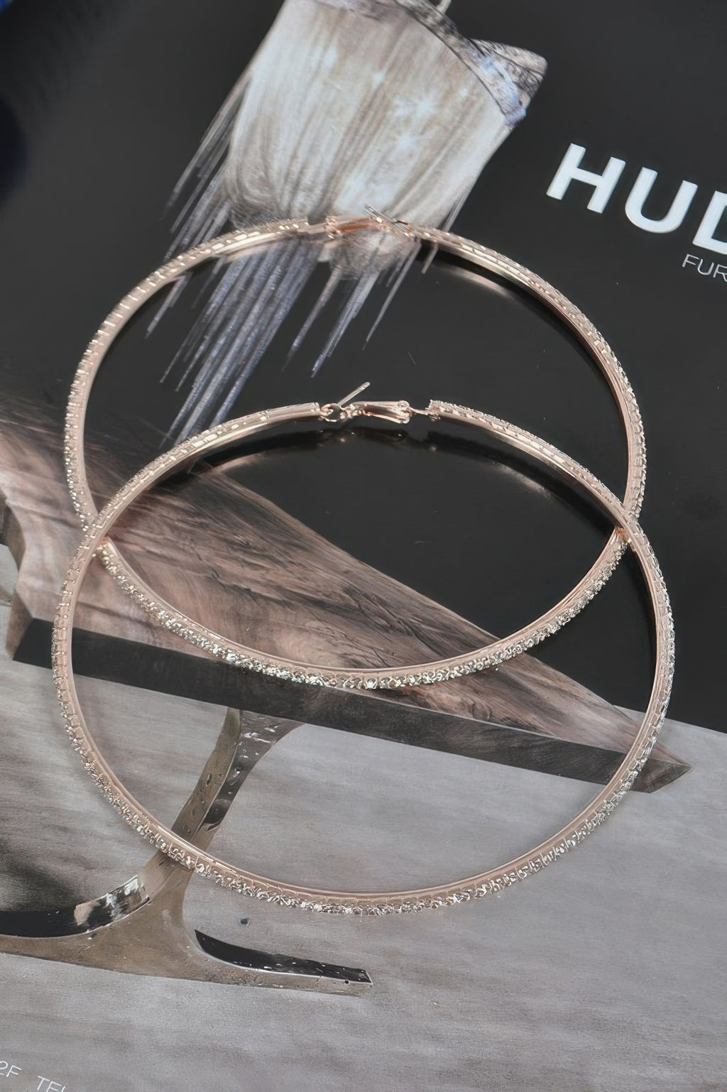 10cm gold-tone double hoop earrings with rhinestone trim and center clasp charm