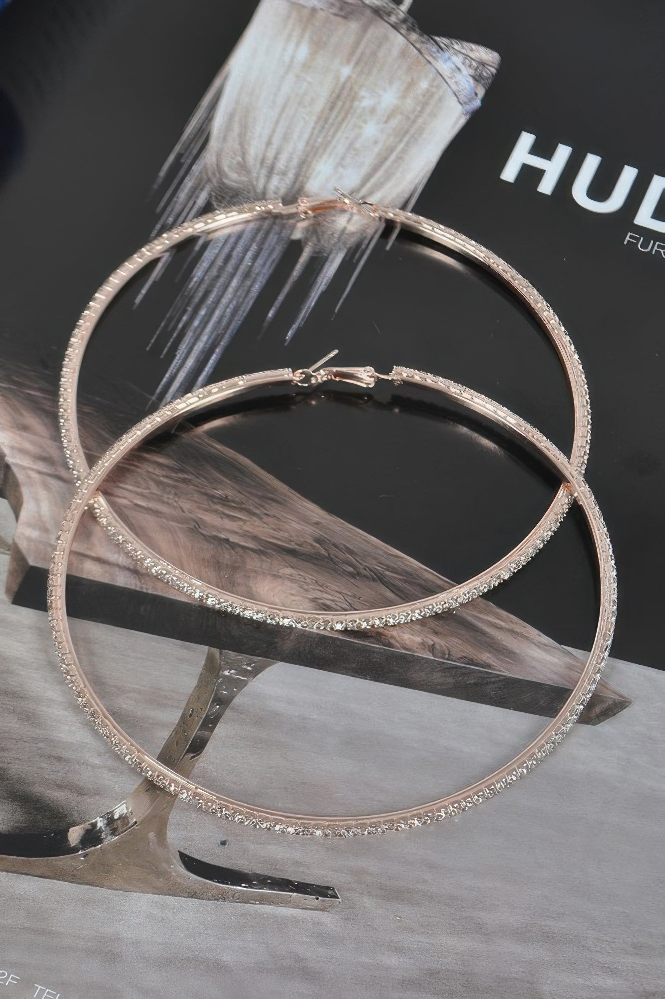 10cm gold-tone double hoop earrings with rhinestone trim and center clasp charm