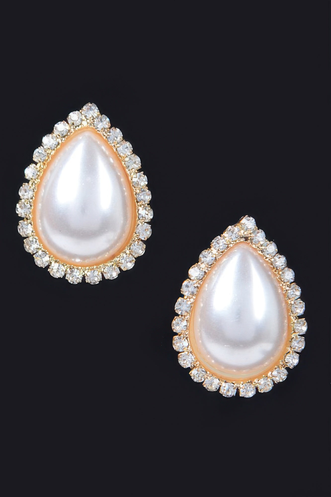 Teardrop pearl stud earrings with gold-tone setting and rhinestone halo