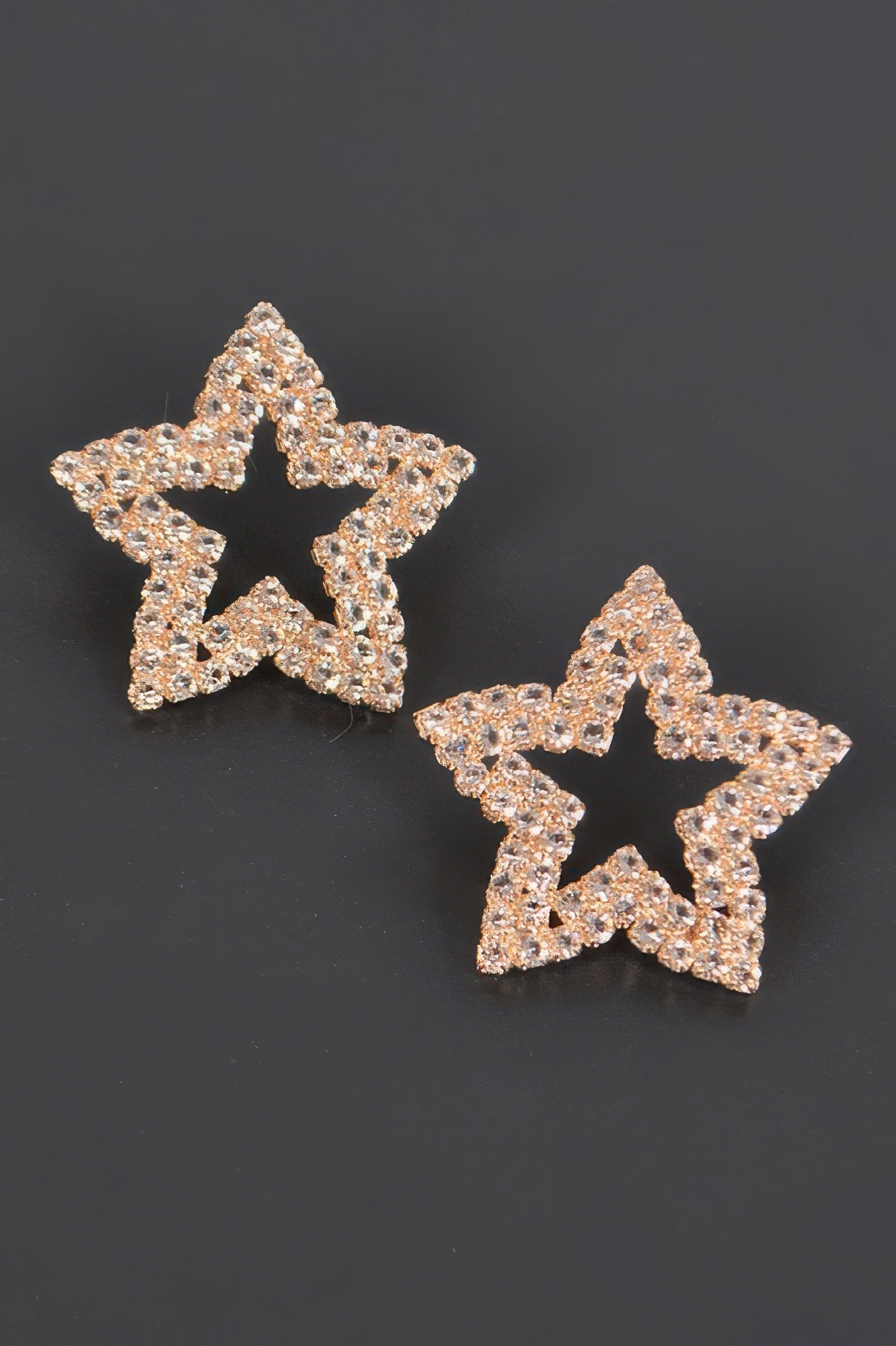 Gold-tone star rhinestone stud earrings, sparkling rose-gold star pair