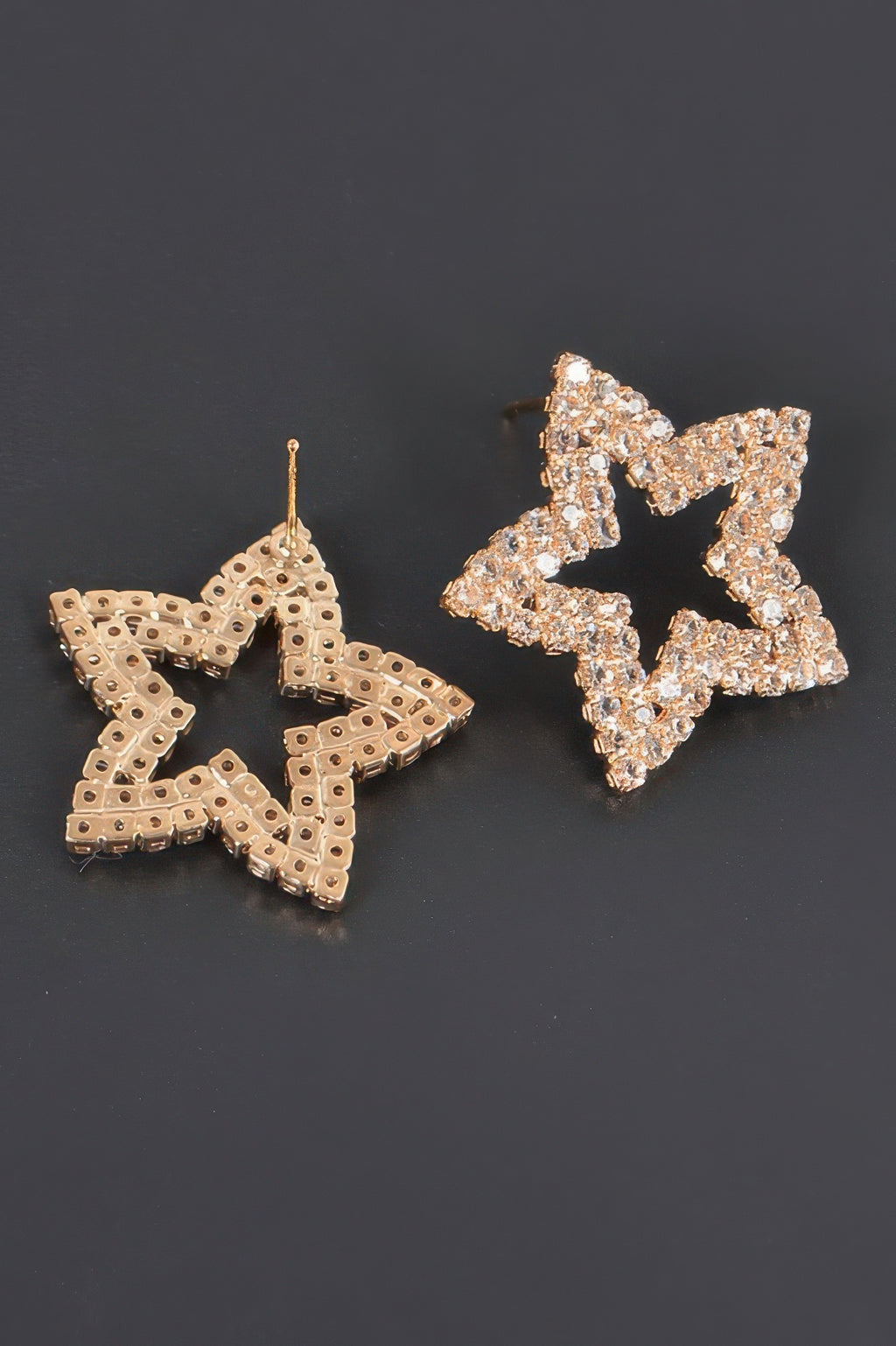 Rose-gold star rhinestone studs, earring posts and backings visible