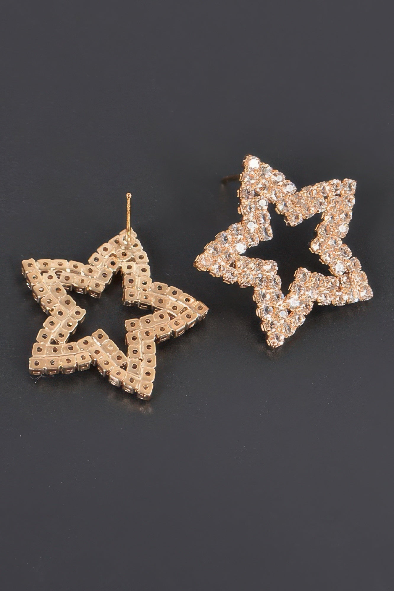 Rose-gold star rhinestone studs, earring posts and backings visible