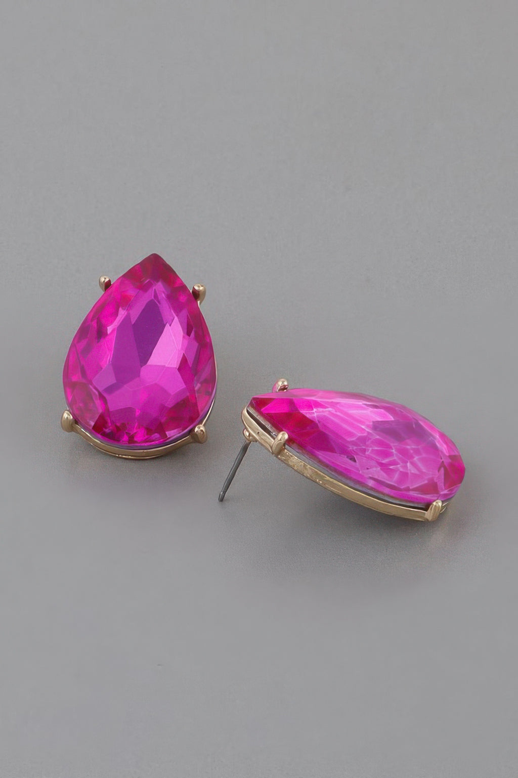 Fuchsia teardrop earrings with faceted crystal and gold-tone oval base