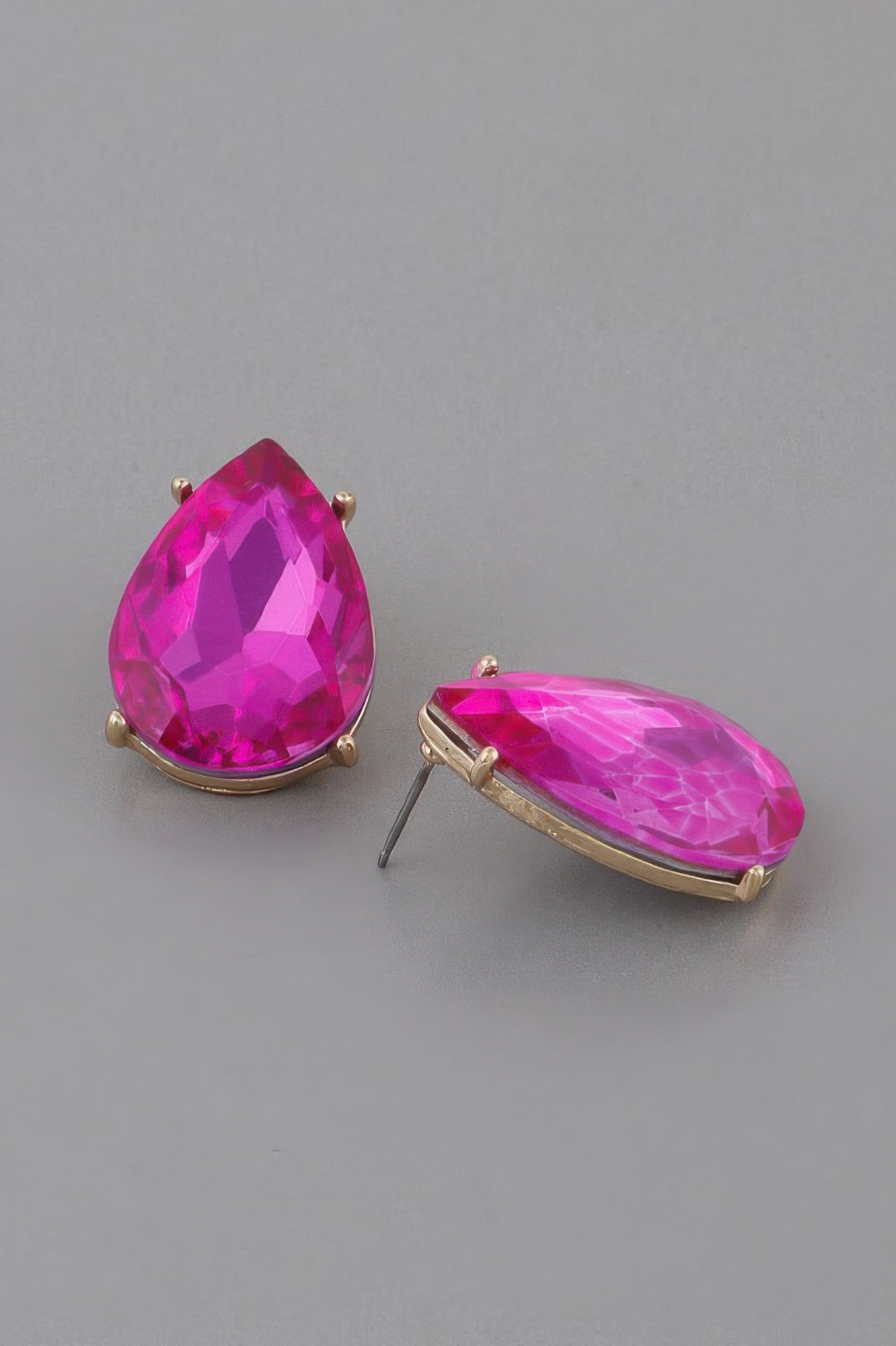 Fuchsia teardrop earrings with faceted crystal and gold-tone oval base