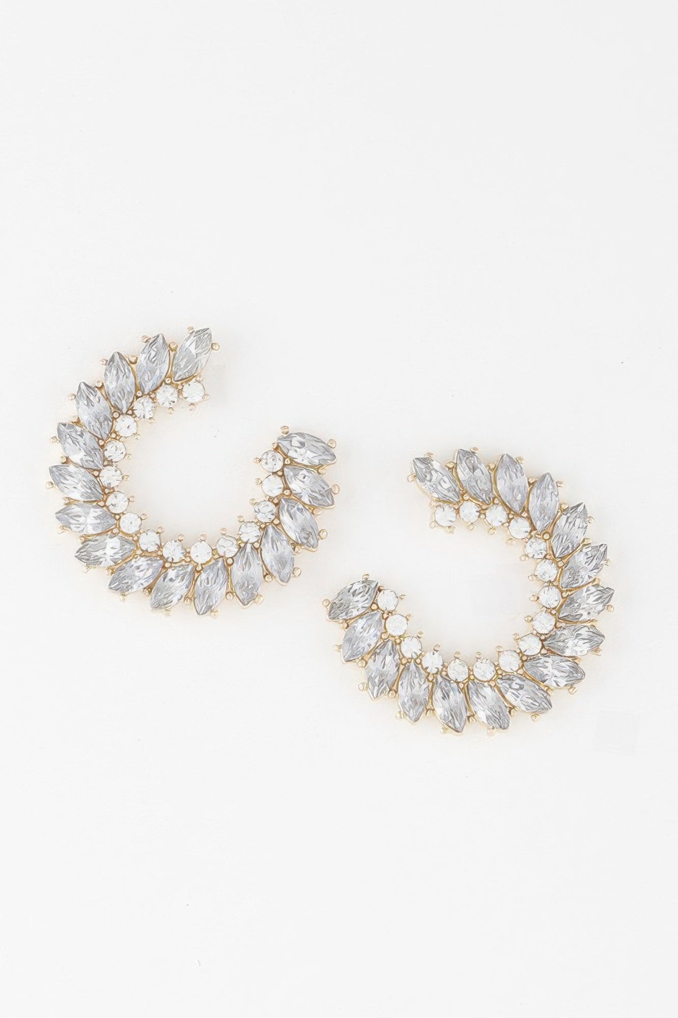 Gold-tone crystal leaf hoop earrings with clear teardrop stones