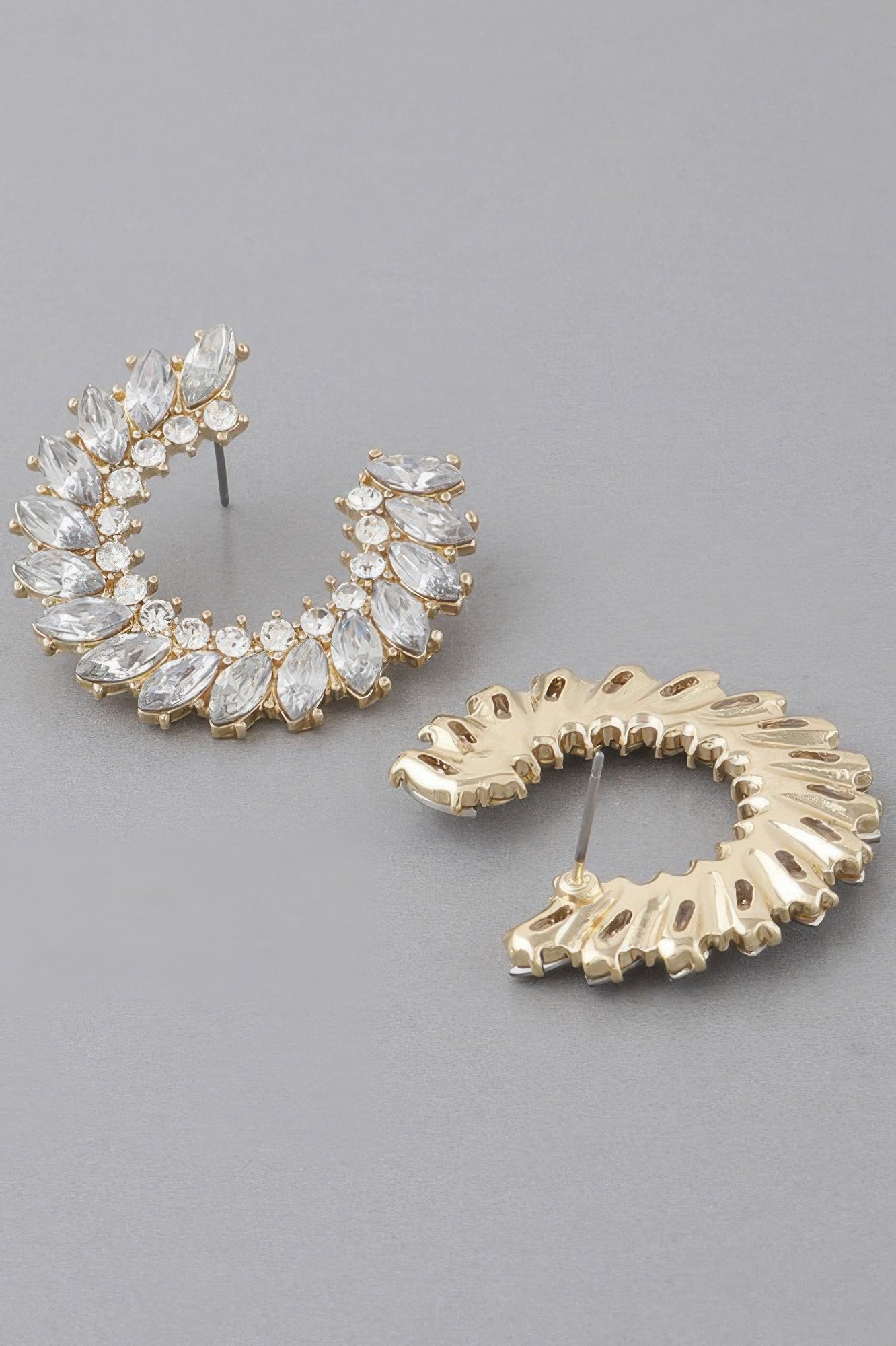 Gold-tone crystal leaf hoop earrings with clear stones and stud posts