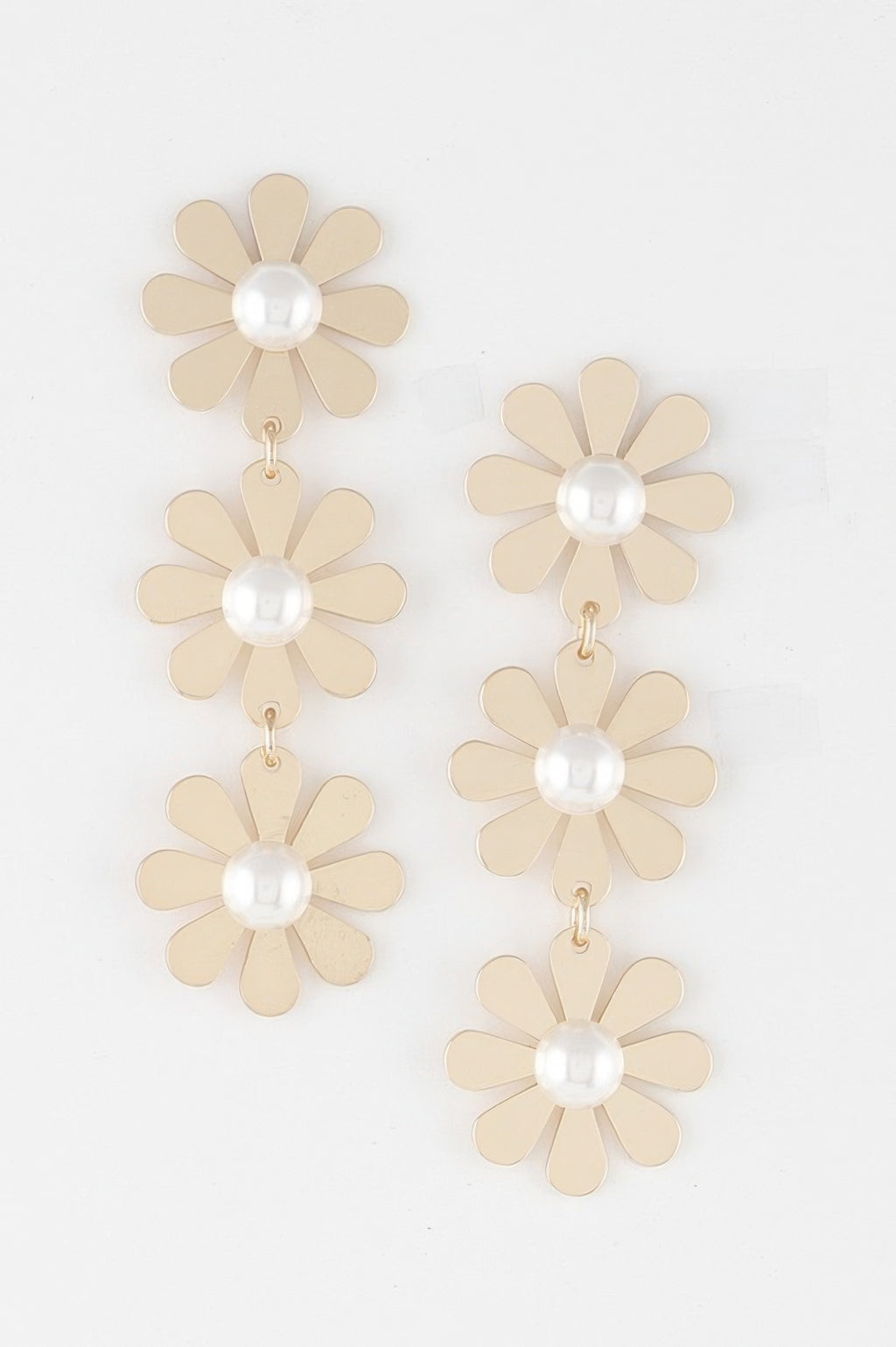 Triple daisy drop earrings: cream petals, pearl centers, gold-tone dangling