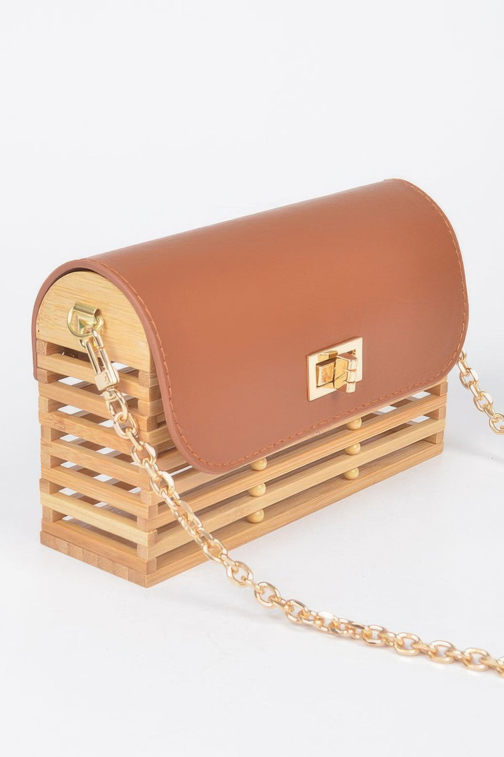 Tan-brown bamboo crossbody bag, curved flap with gold lock, gold chain side view