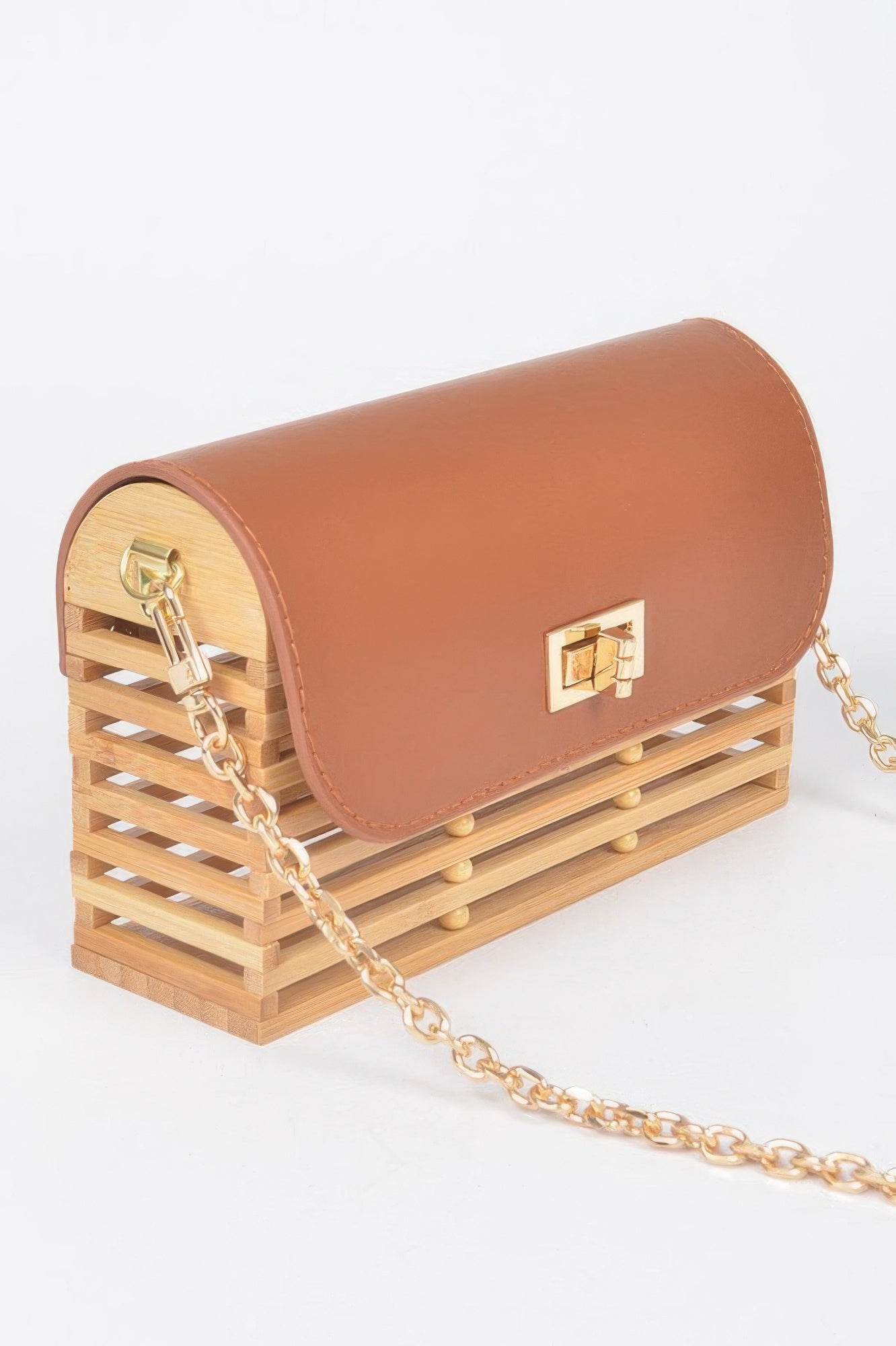 Tan-brown bamboo crossbody bag, curved flap with gold lock, gold chain side view