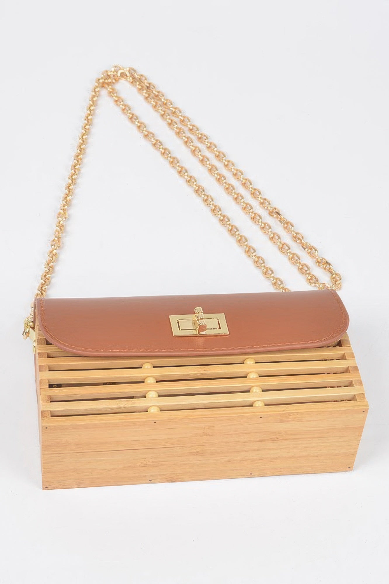 Tan-brown bamboo flap crossbody bag with gold clasp and long gold shoulder chain