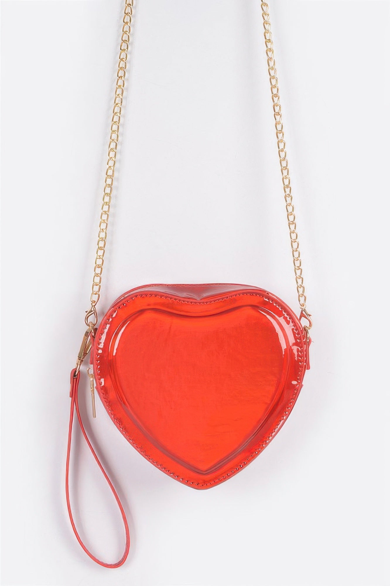 Heart-shaped metallic crossbody bag in red with gold chain strap and wristlet pull