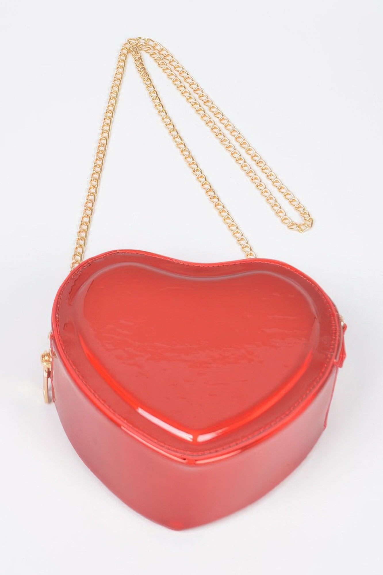 Red heart crossbody bag with gold chain shoulder strap and small side zipper pocket