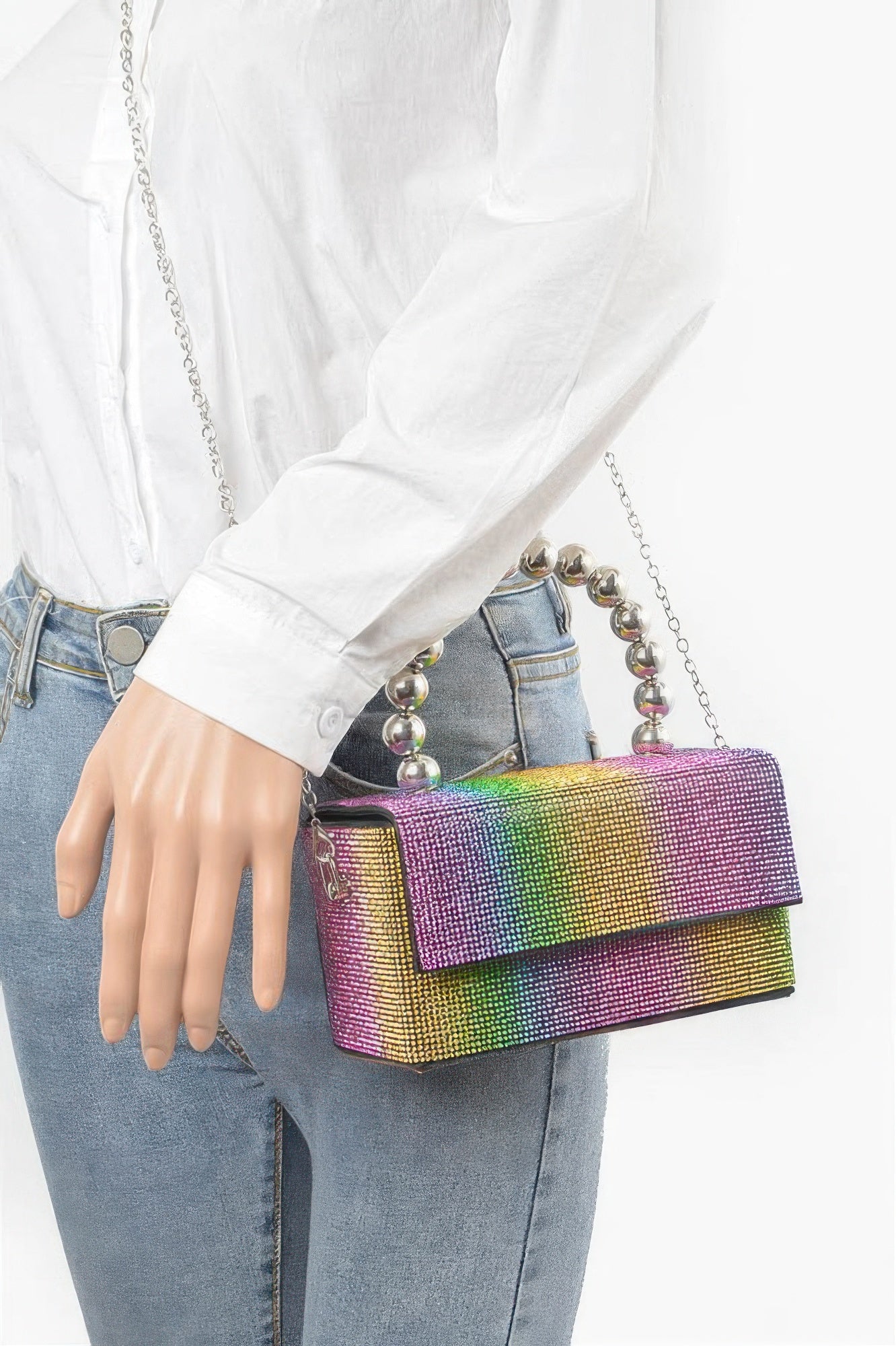Rhinestone ball chain handle bag in rainbow glitter, worn with crossbody style chain
