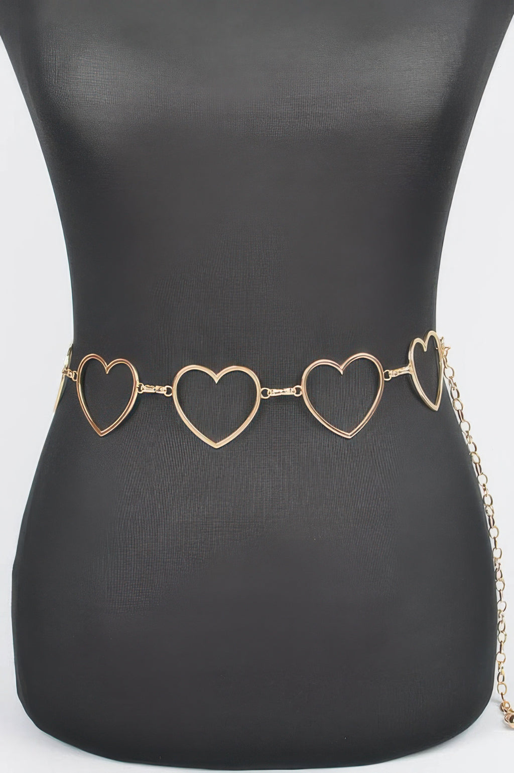 Heart chain belt with three gold heart links on black waist, adjustable length