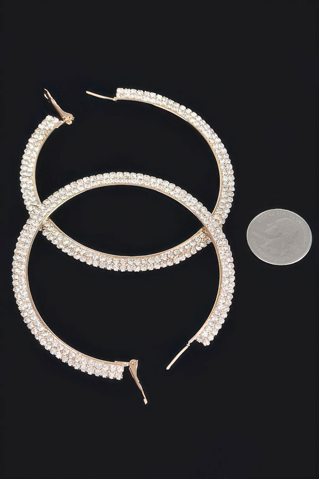 Gold-tone rhinestone hoop earrings, close view of hook backs and clasp