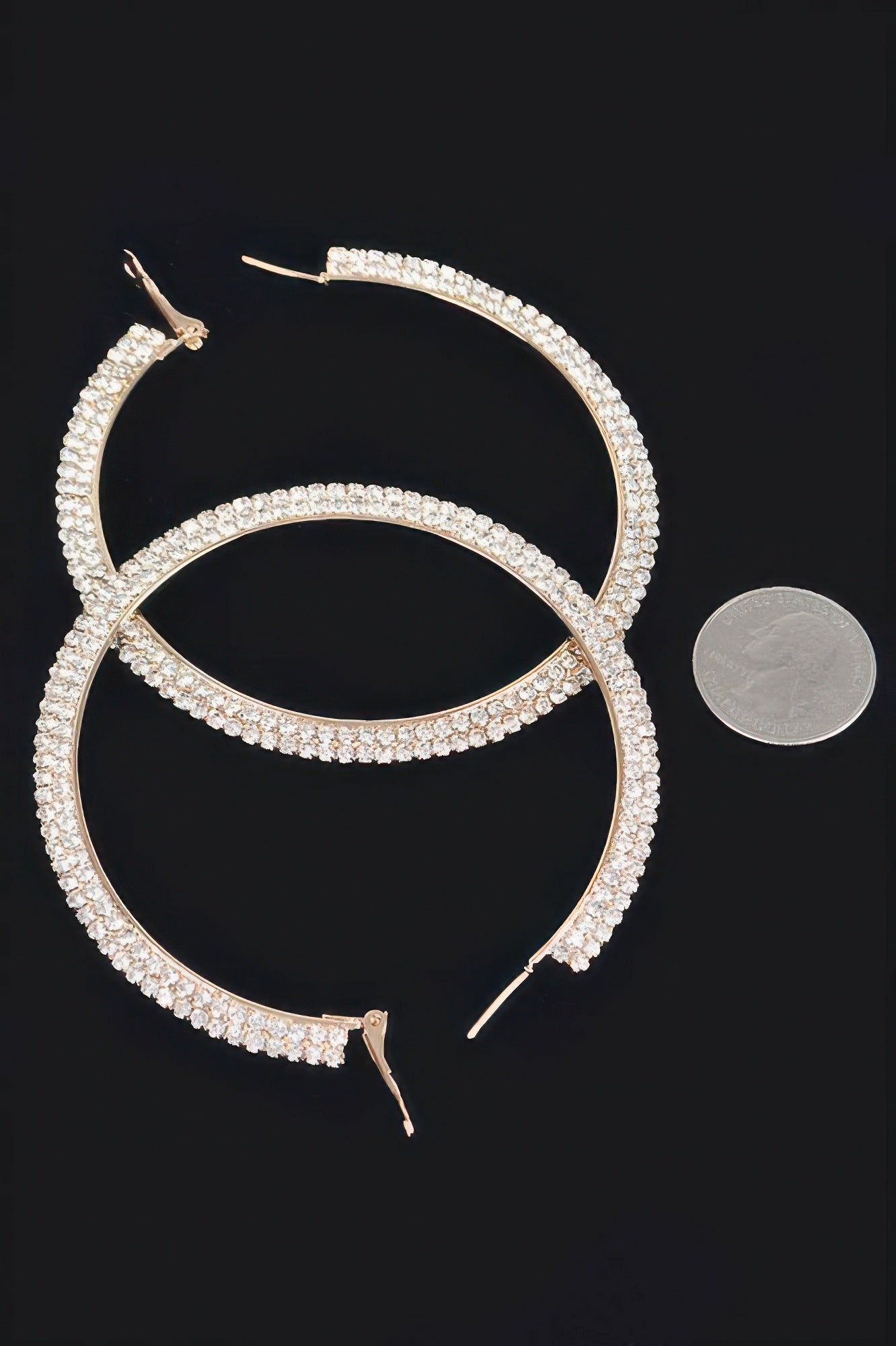 Gold-tone rhinestone hoop earrings, close view of hook backs and clasp