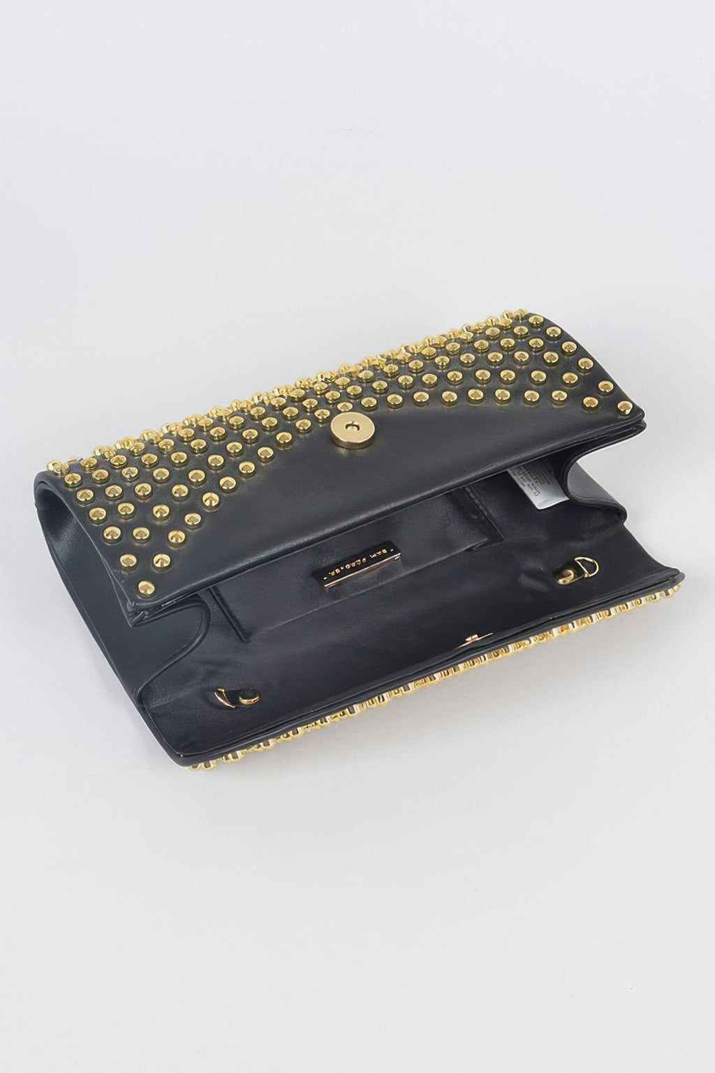 Open black studded clutch showing interior pocket and gold studded flap