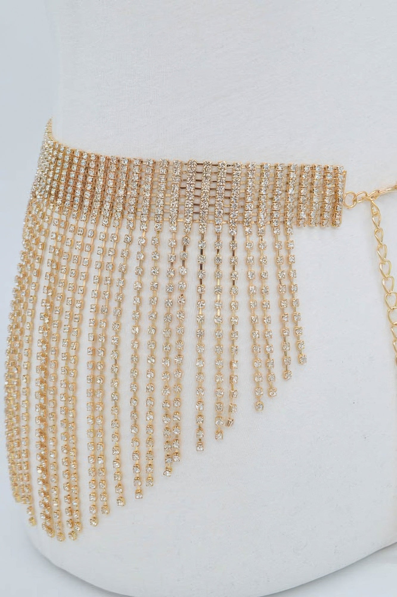 Gold rhinestone waistband with fringe drop chains along the side