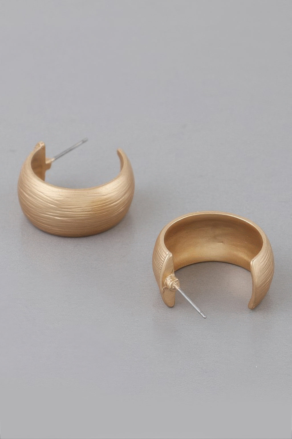 Gold-tone bulky hoop earrings, curved scraped texture and hinge-style post backs