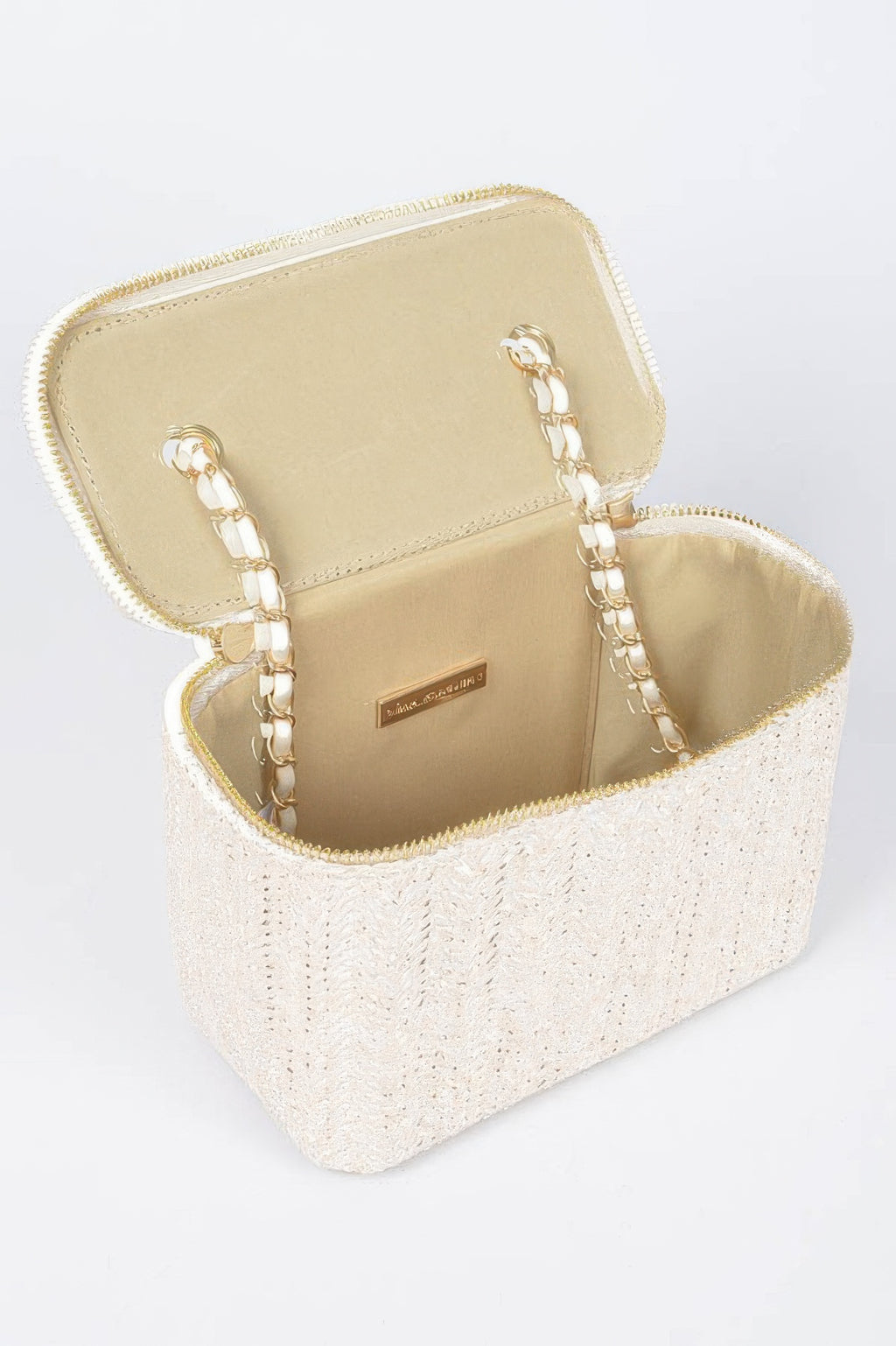 Open faux straw cosmetic case with beige lining, gold hardware, and zip closure