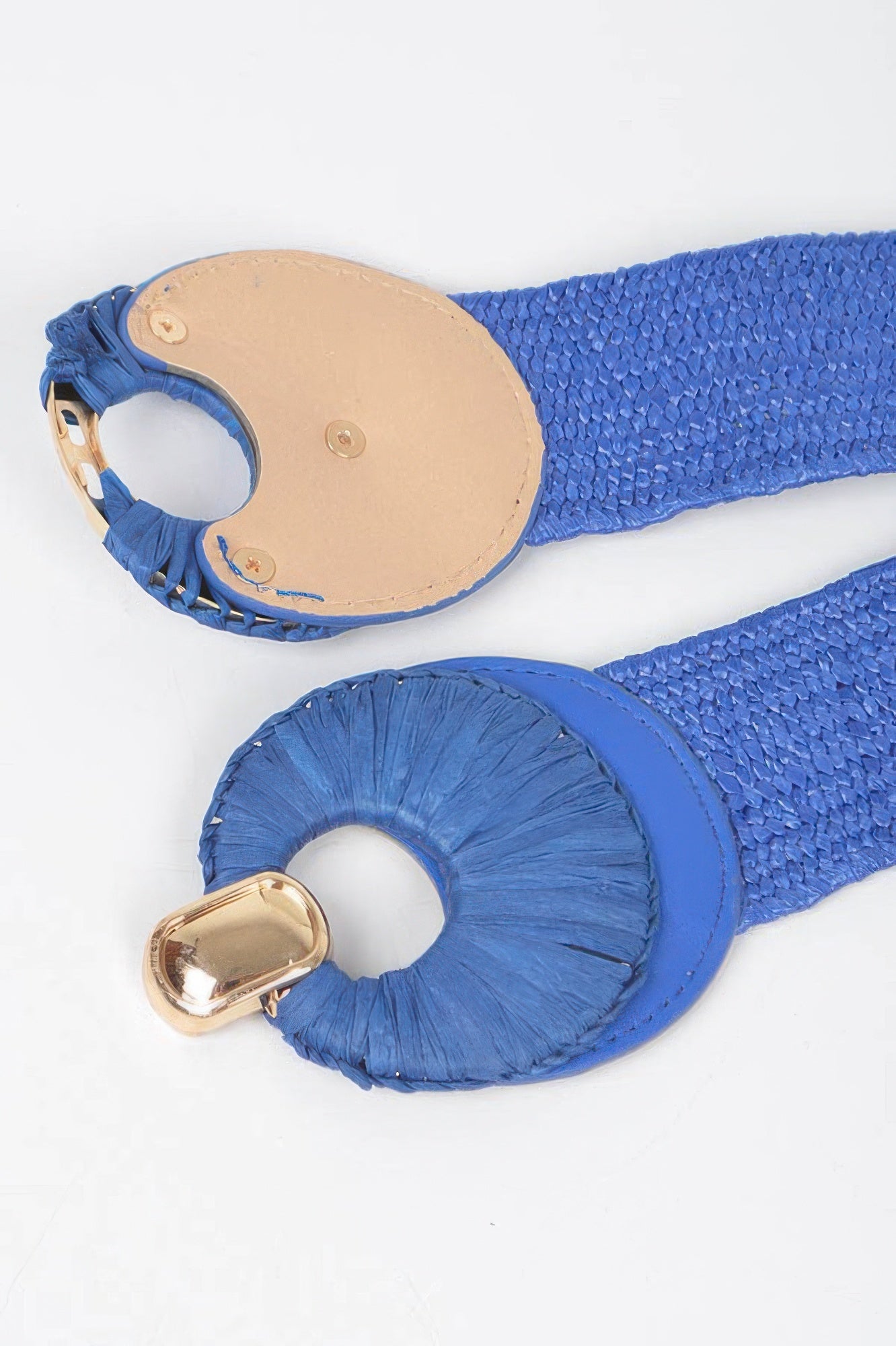 Faux straw belt close-up, blue texture elastic with gold-tone buckle and round loops