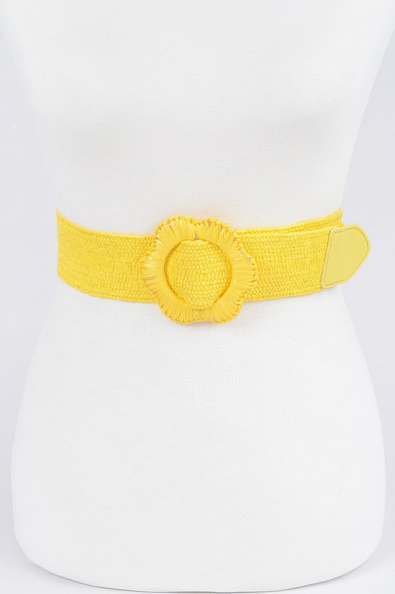 Faux straw elastic belt in yellow with fabric flower centerpiece and tab buckle