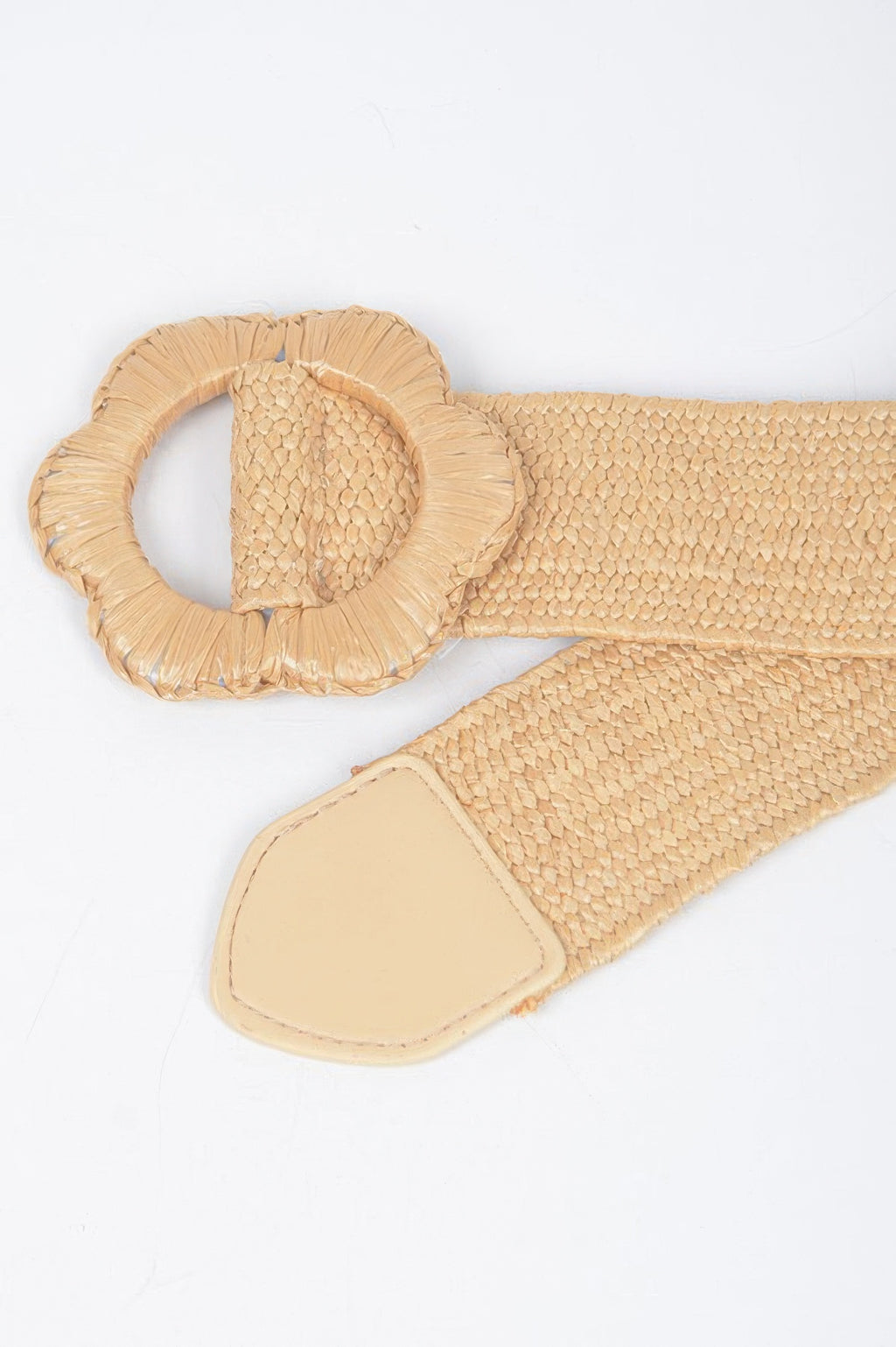 Faux straw elastic belt close-up in khaki beige with textured weave, flower ring, and tab