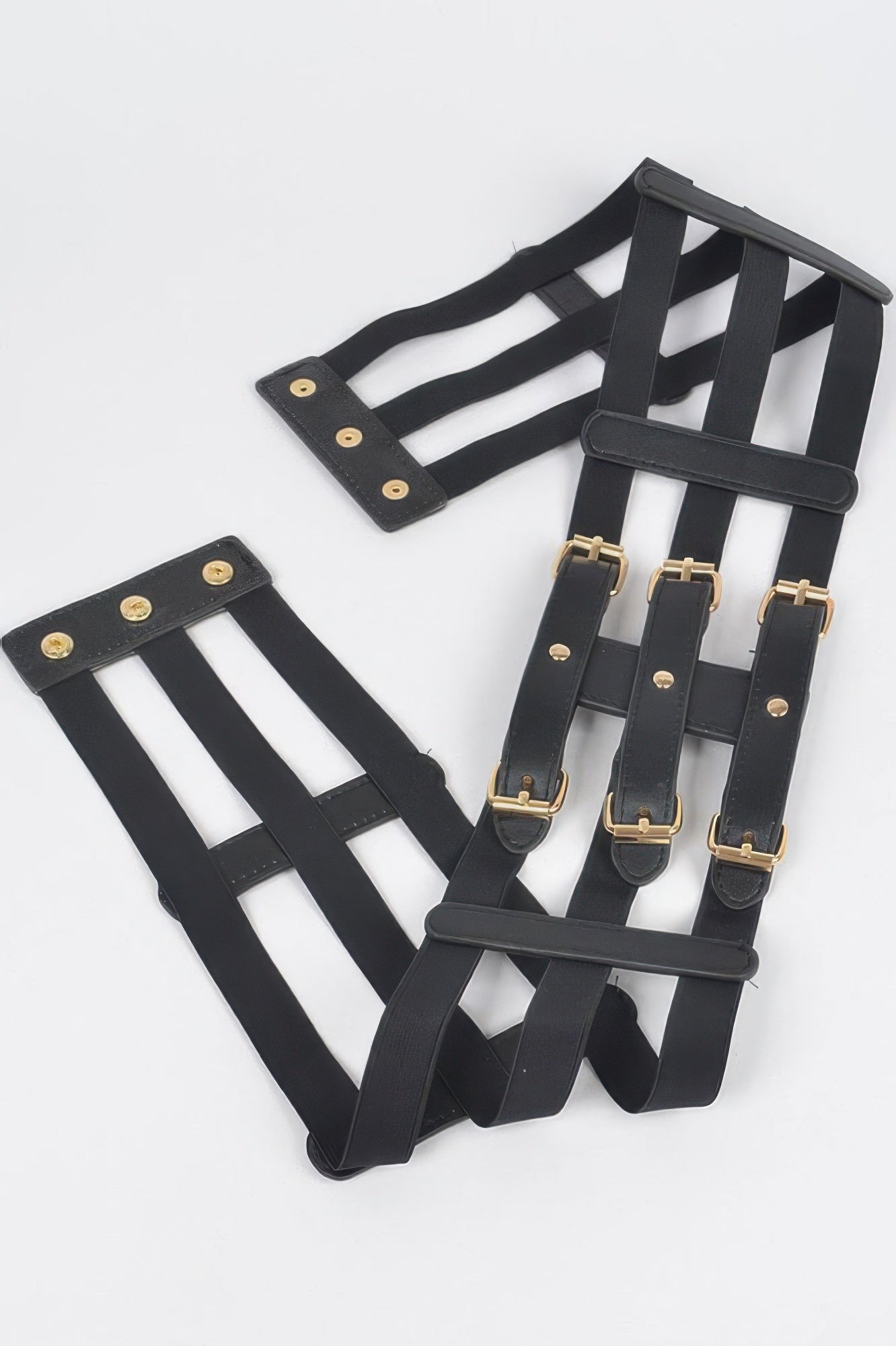 Set of black wide elastic straps with gold-tone buckles and square rings