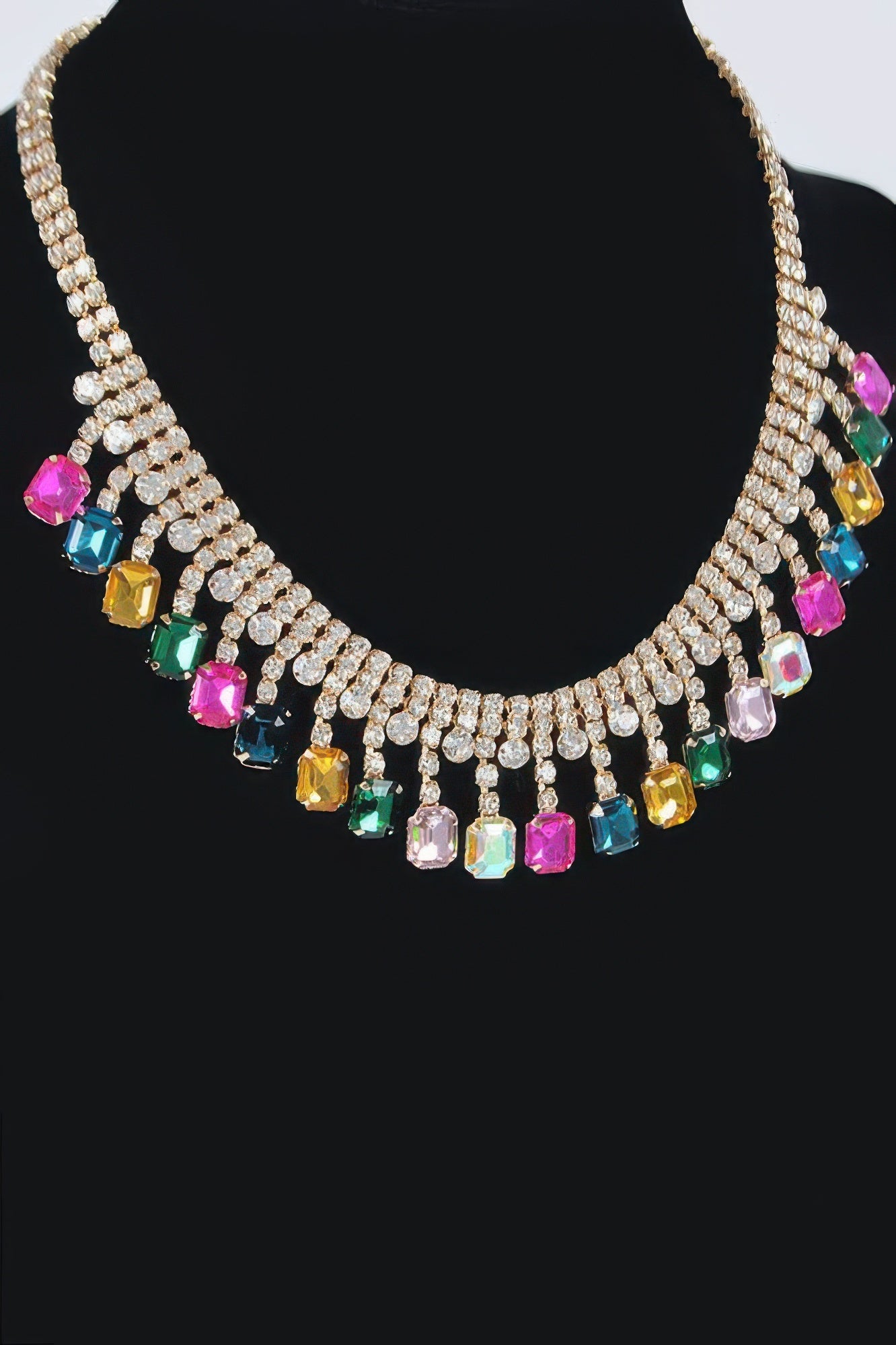 Gold-tone rhinestone choker with colorful dangling crystals around the neckline
