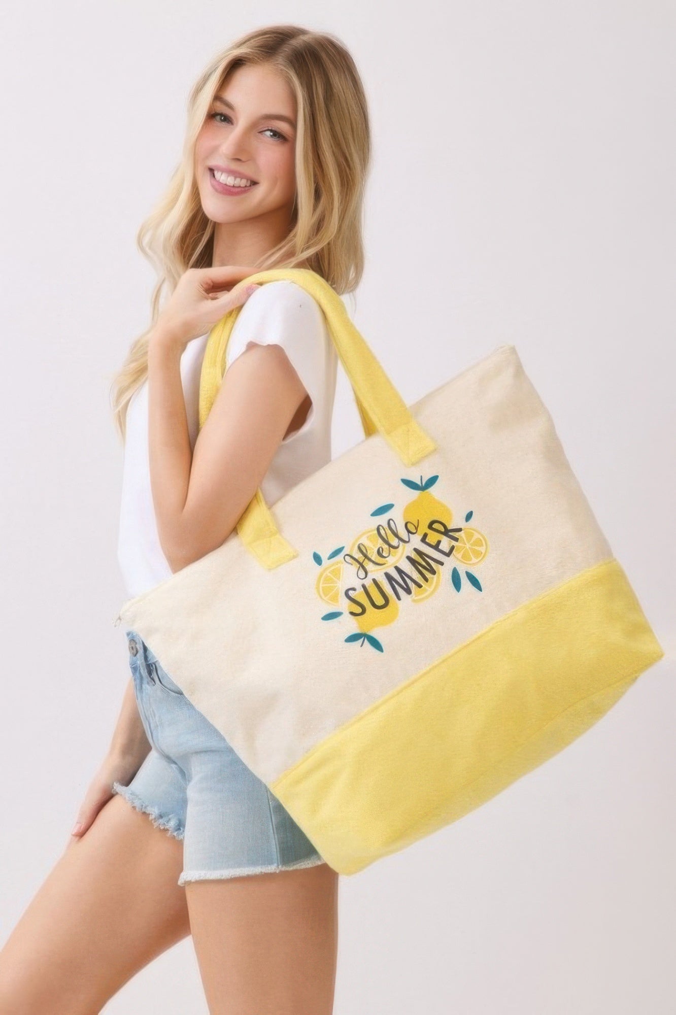 Hello Summer Terry Tote, cream body with yellow bottom, front “Hello Summer” text and flowers