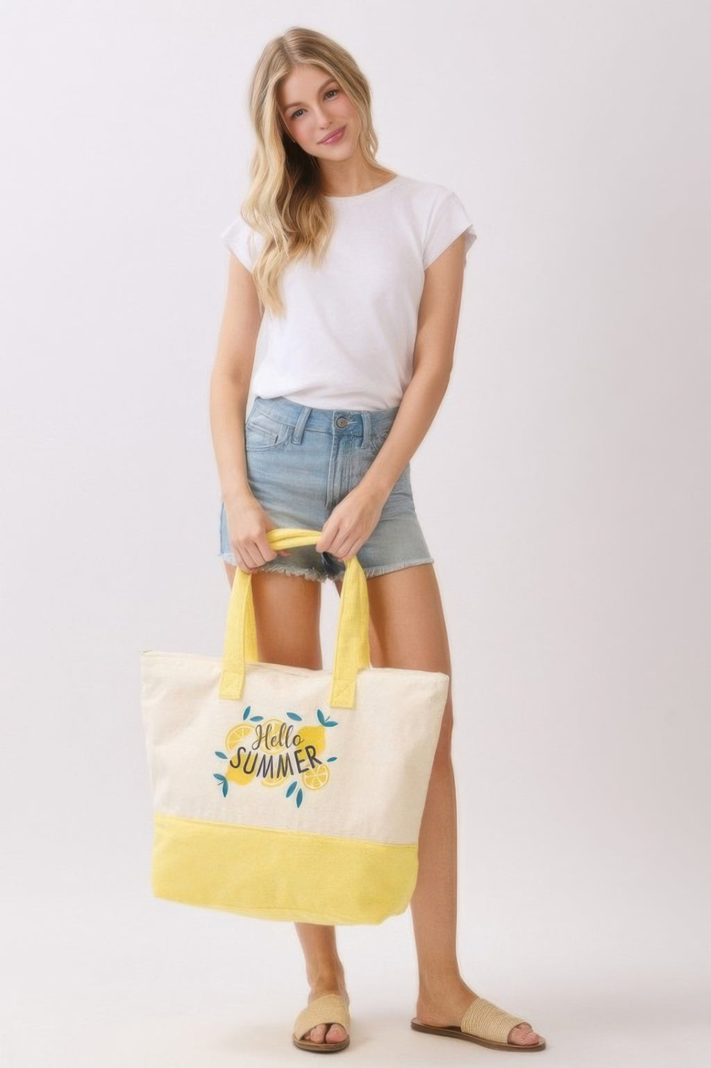 Hello Summer tote, cream body with yellow bottom and handles, front “Hello Summer” graphic