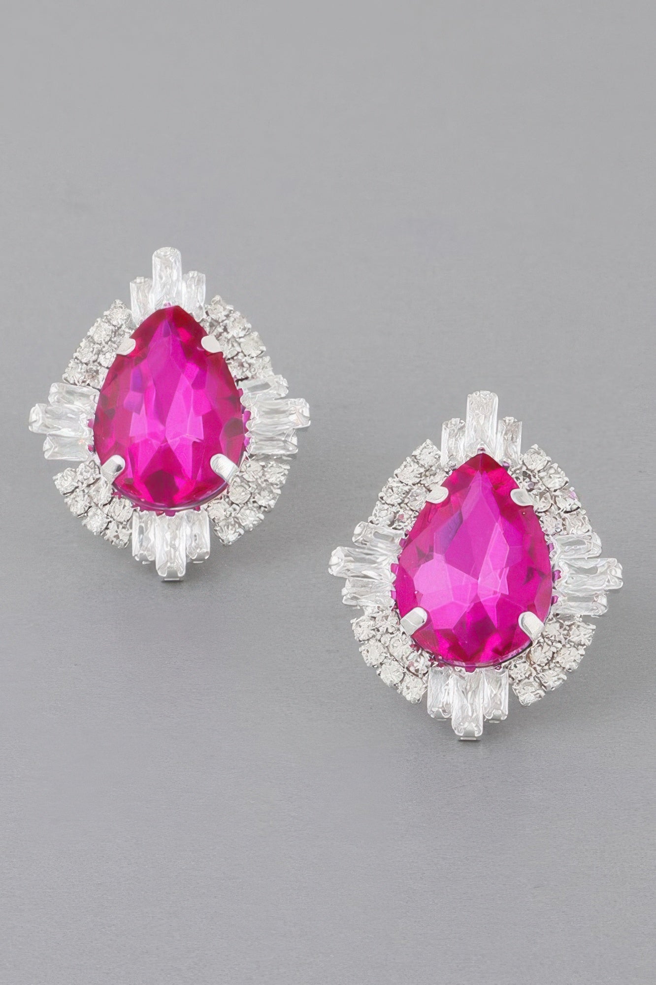 Jeweled teardrop crystal stud earrings in fuchsia with silver-toned sparkle frame