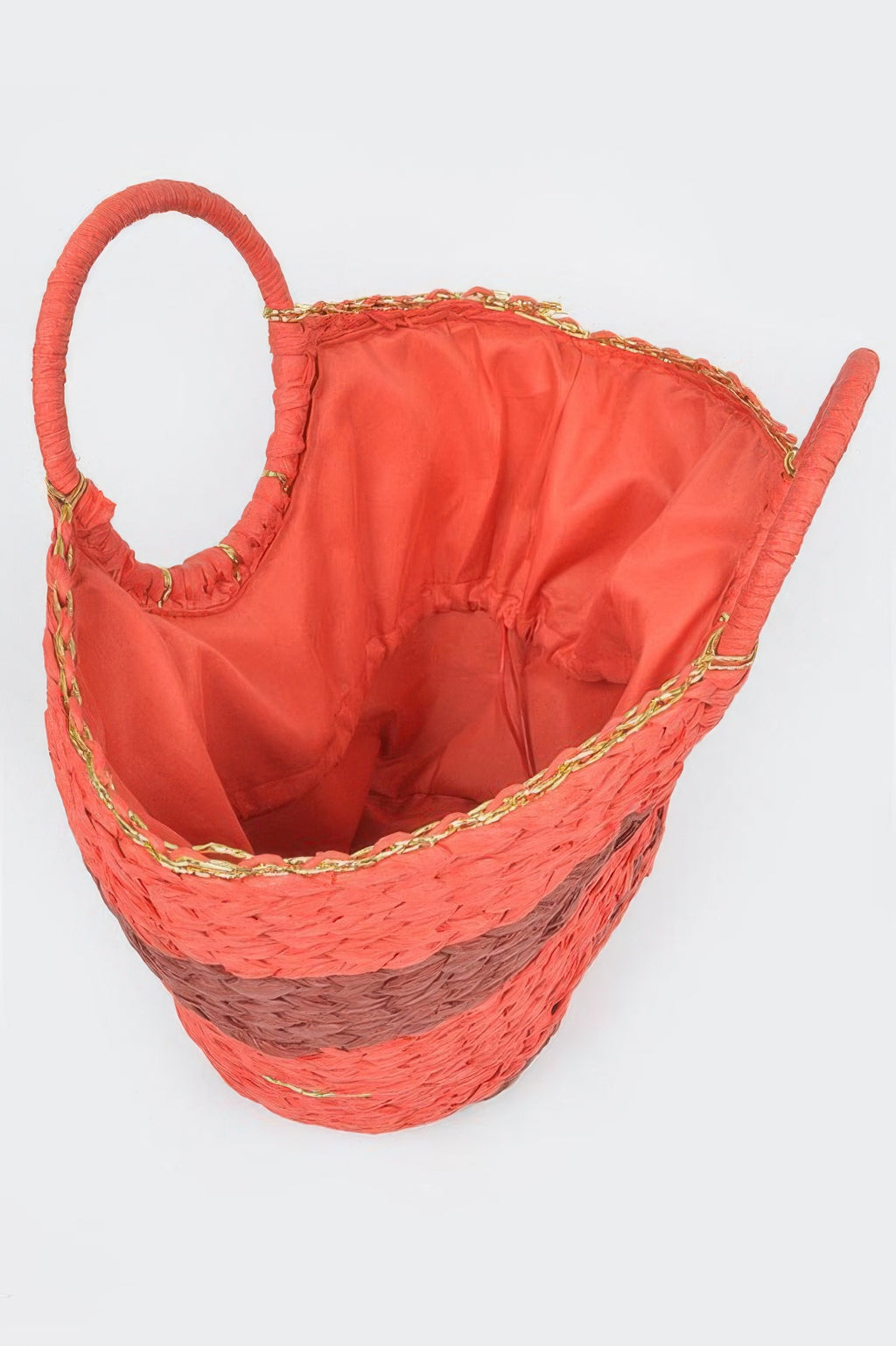 Orange straw tote interior with fabric lining and gold chain trim