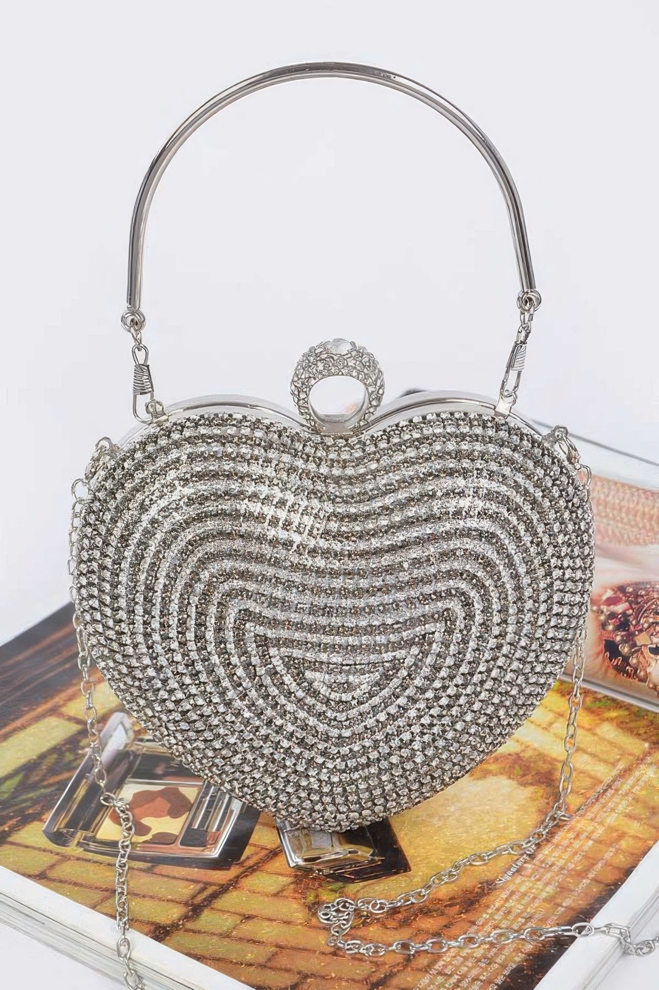 Rhinestone heart-shaped party clutch with top handle and dangling shoulder chain, silver-tone