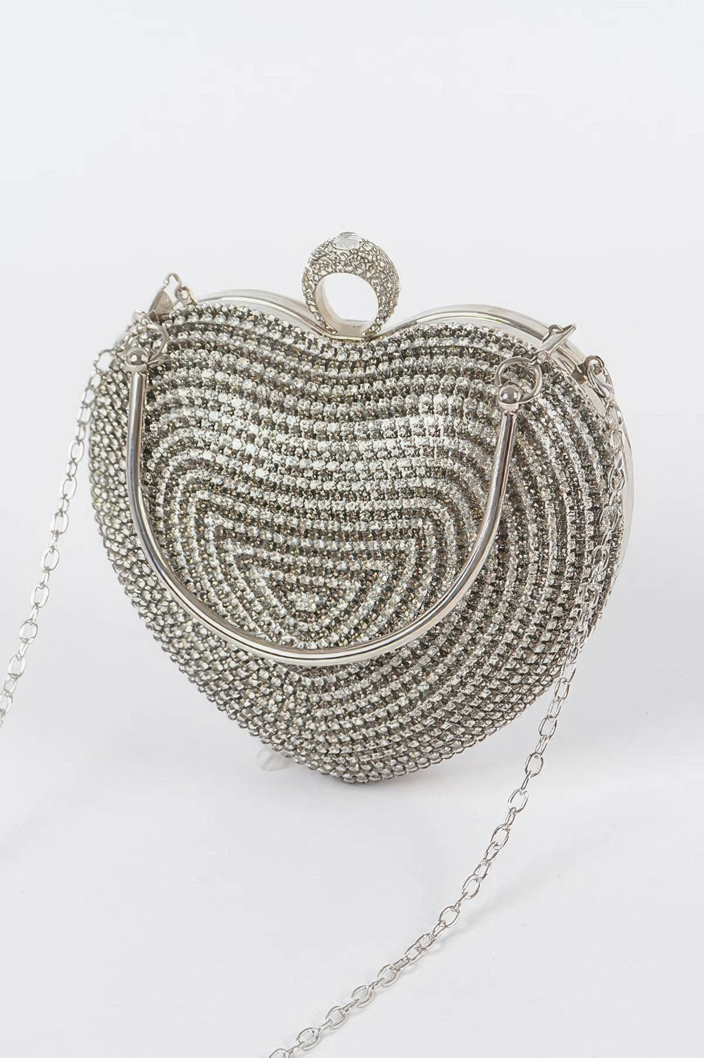 Heart-shaped rhinestone clutch with hinged clasp and silver-tone chain strap