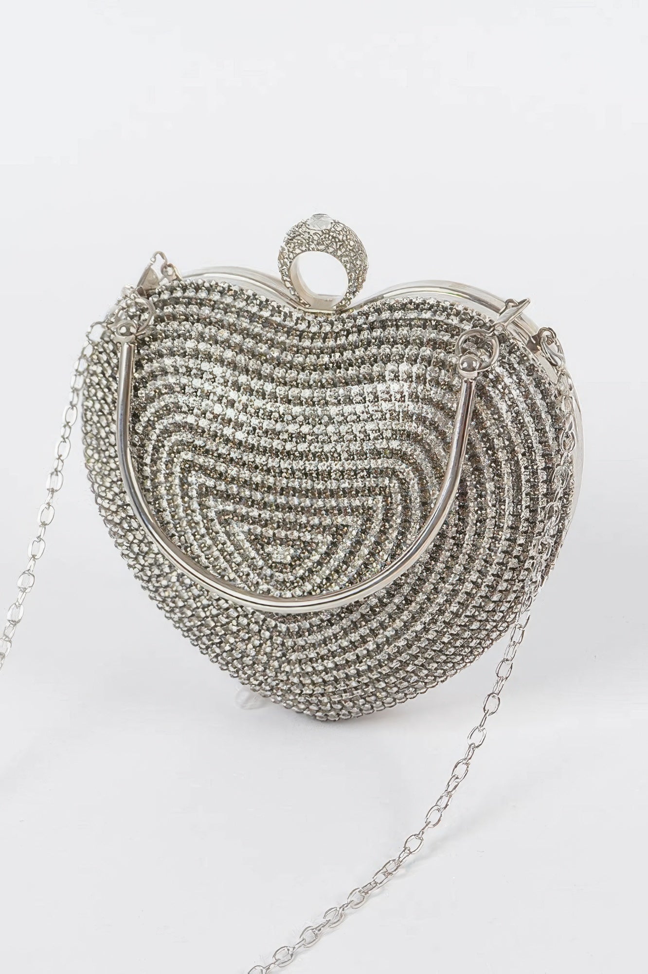 Heart-shaped rhinestone clutch with hinged clasp and silver-tone chain strap