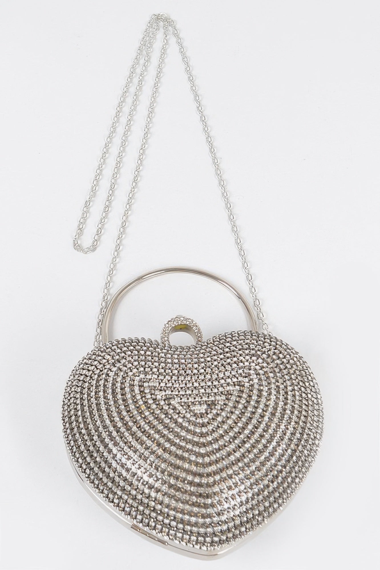 Heart-shaped rhinestone clutch with top handle loop and long chain strap, silver-tone