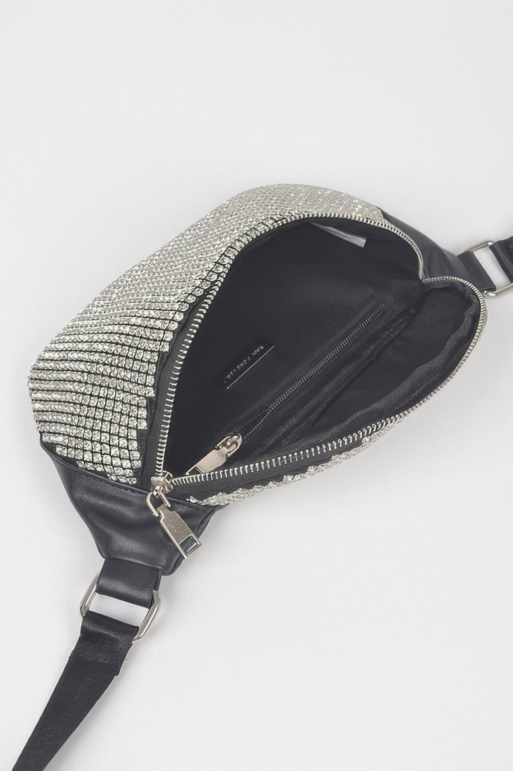 Rhinestone mesh fanny pack open interior, silver mesh front and black zipper