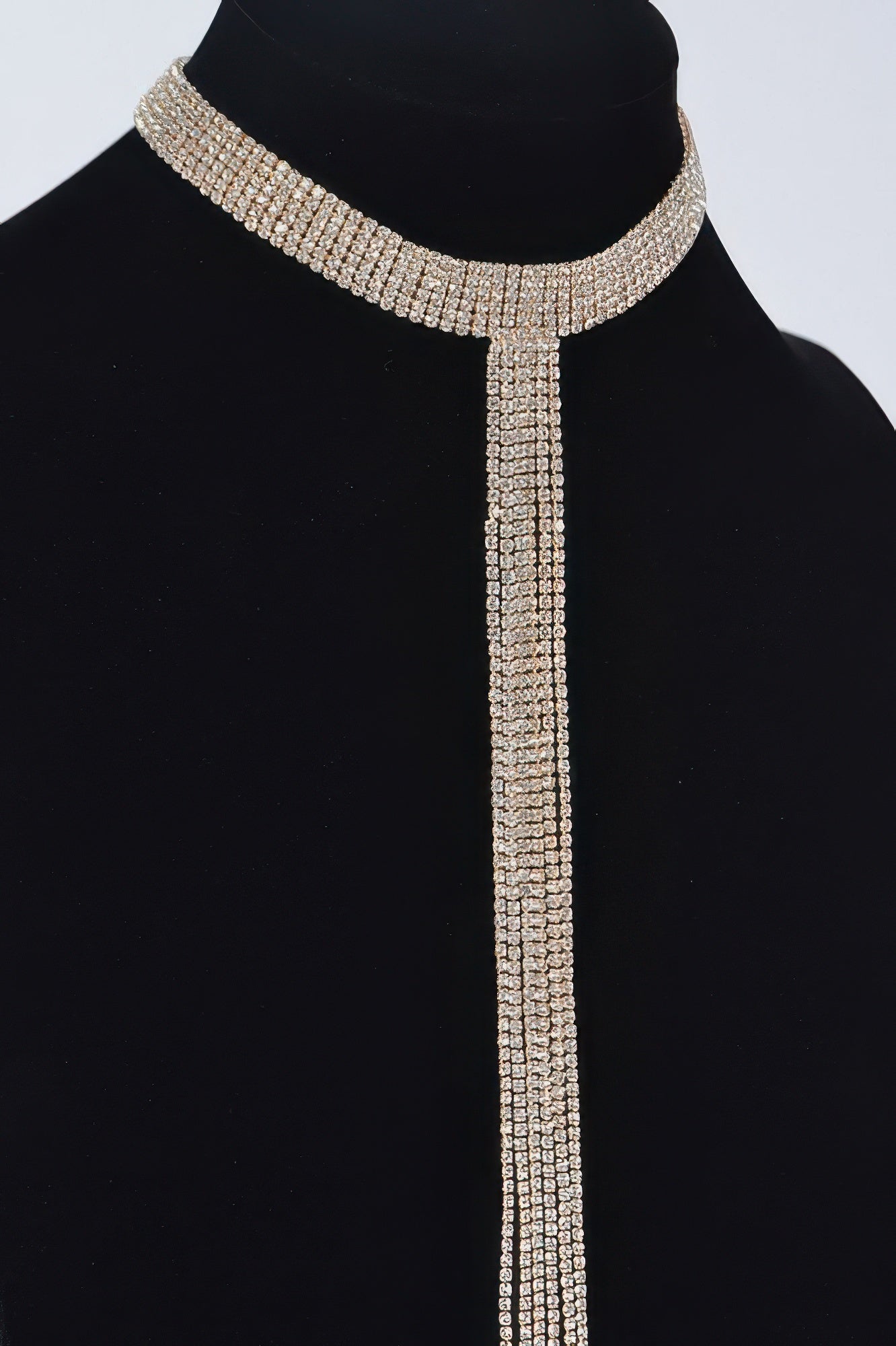 Silver rhinestone choker necklace featuring wide collar and cascading double strands