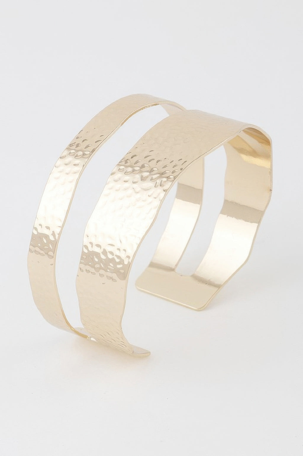 Double hammered open cuff bracelet in gold, curved double band design.