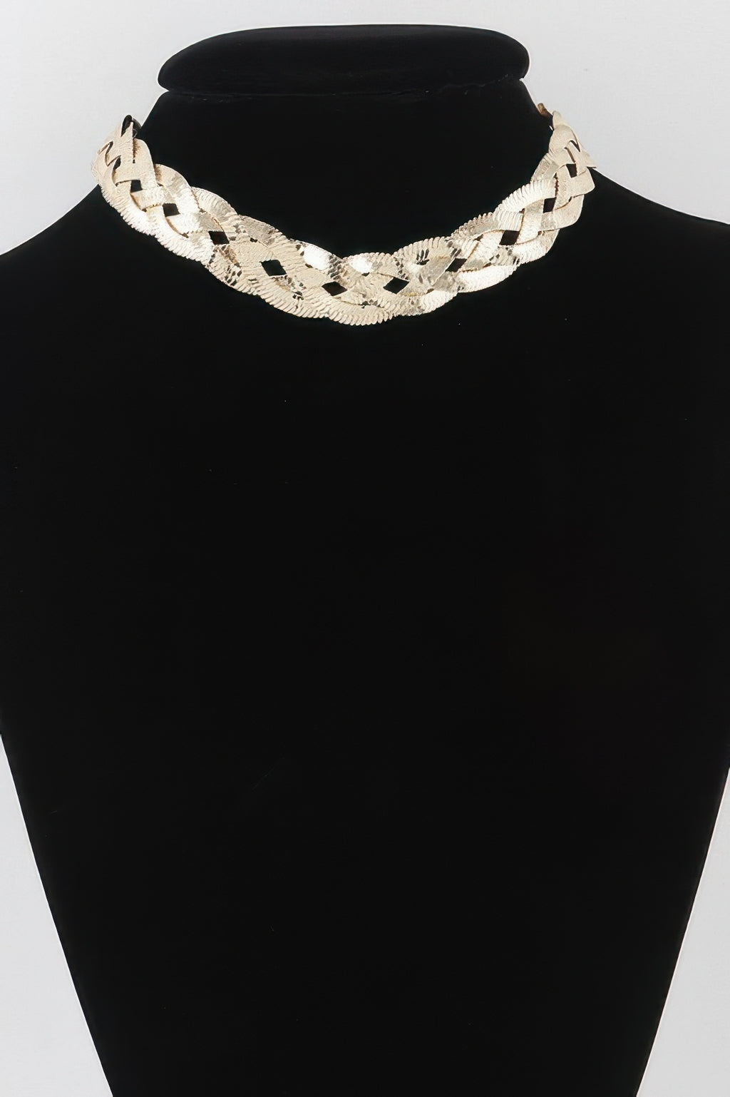 Triple braid snake chain necklace, gold-toned, on mannequin bust