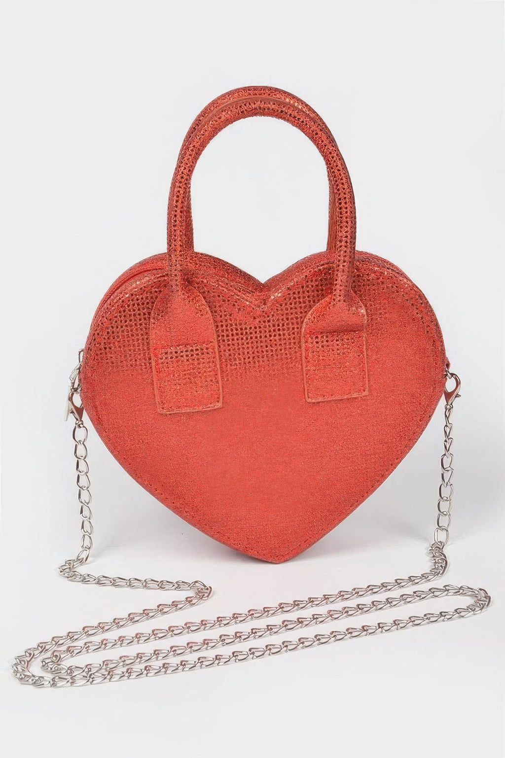 Red metallic heart crossbody bag with top handles and silver chain strap