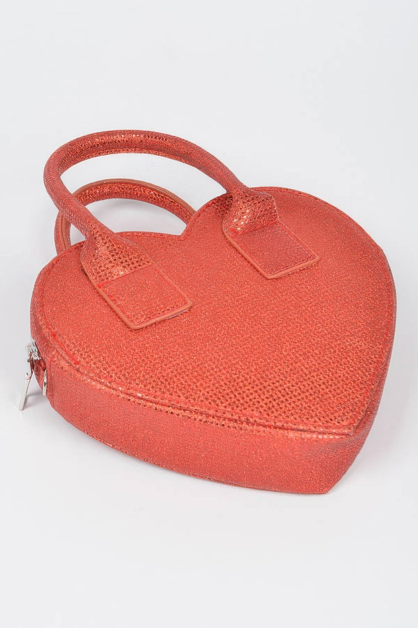 Red textured metallic heart mini bag with top handles and zipper detail