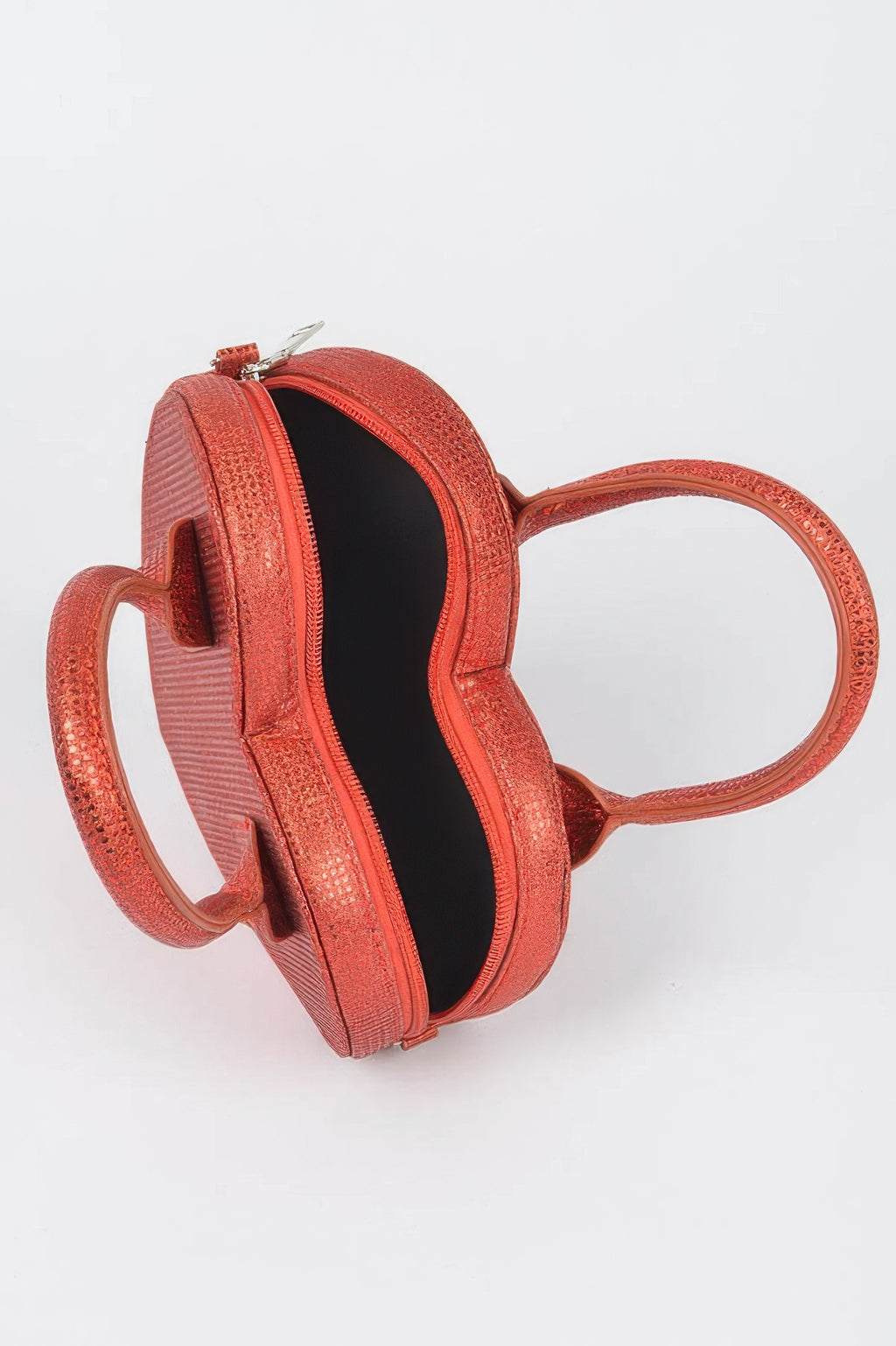 Red heart crossbody bag with open top, black lining, and zipper closure