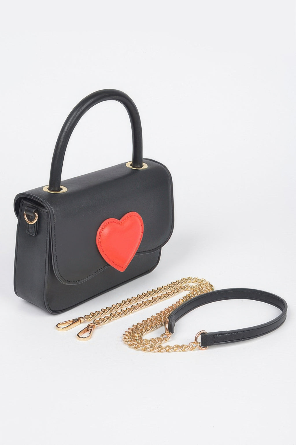 Black vegan crossbody bag with red heart front, top handle, and chain strap