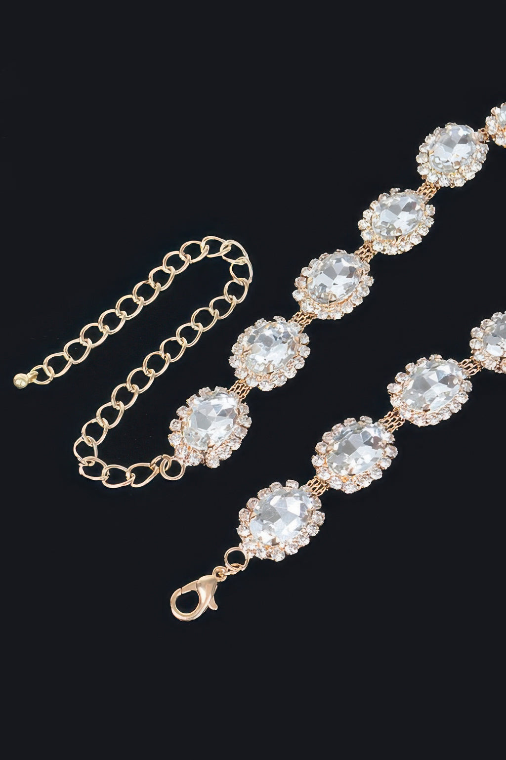 Rhinestone oval necklace detail: gold-tone chain with oval clear stones and lobster clasp.
