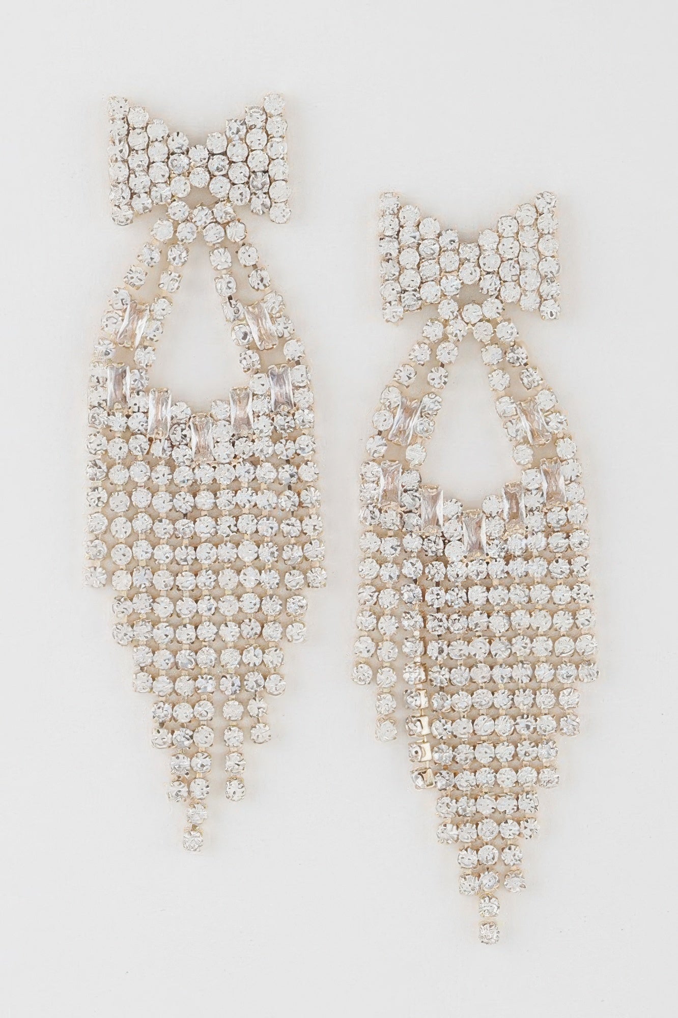 Rhinestone ribbon drop earrings with top bow and layered dangling strands of round crystals