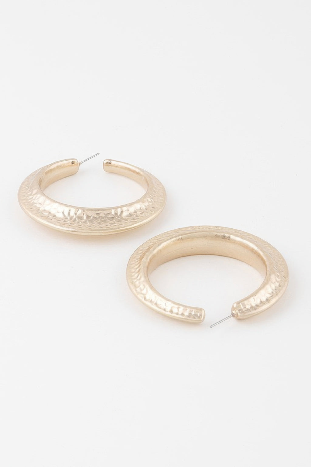 Pair of scaled indent hoop earrings with W gold-tone textured finish