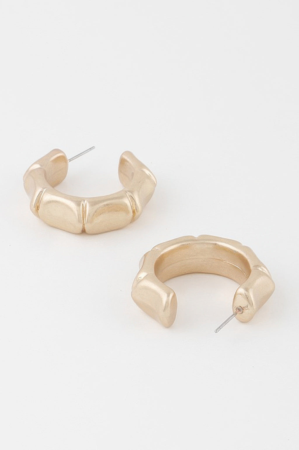 Gold skeleton hoop earrings with curved outer links and stud posts